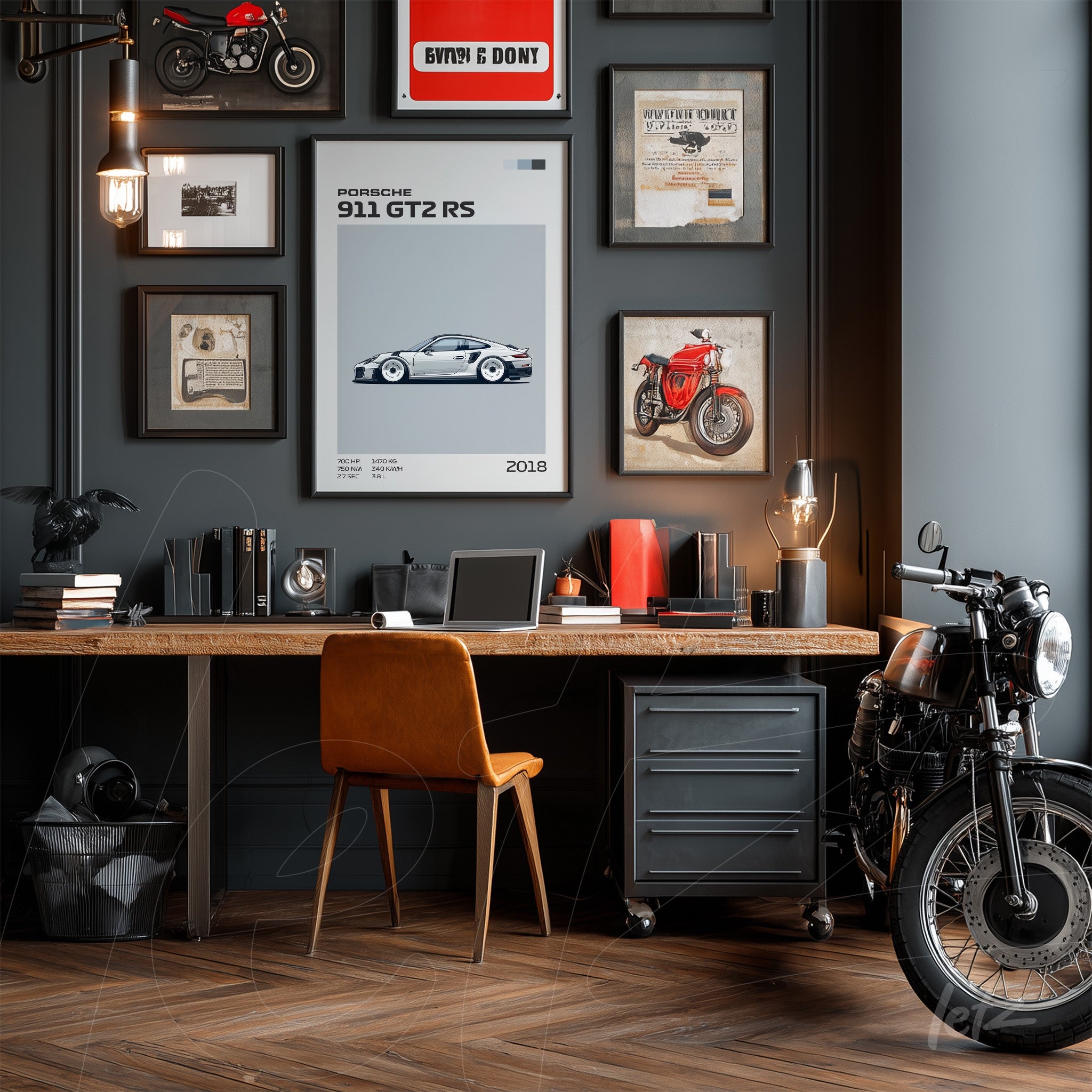 wall composition featuring motorcycle and car art in a dark room, wooden desk with leather chair and vintage motorcycle beside