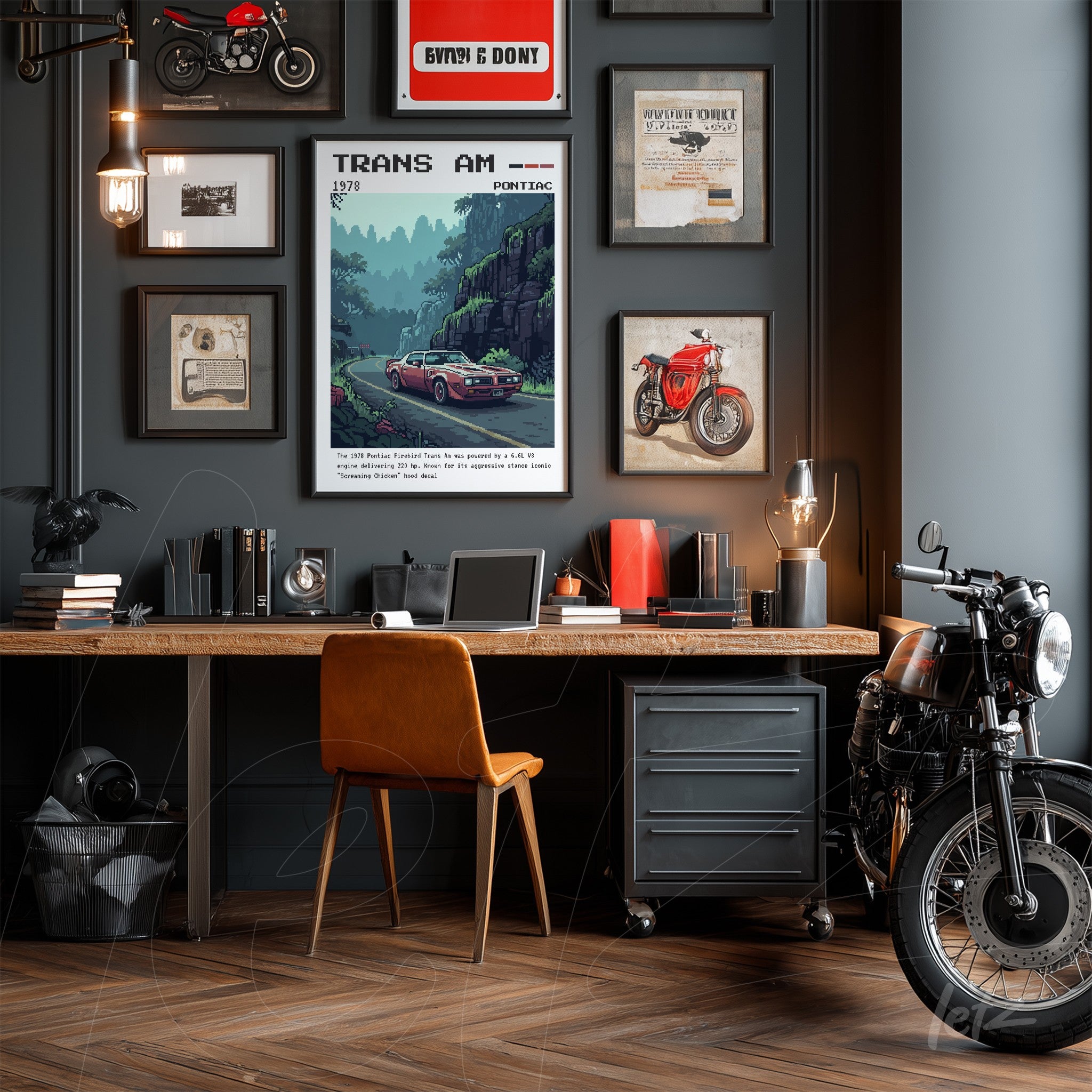gallery wall composition in a modern setting featuring automotive theme including framed Trans Am sports car art, black frame, wooden desk, and a vintage motorcycle beside