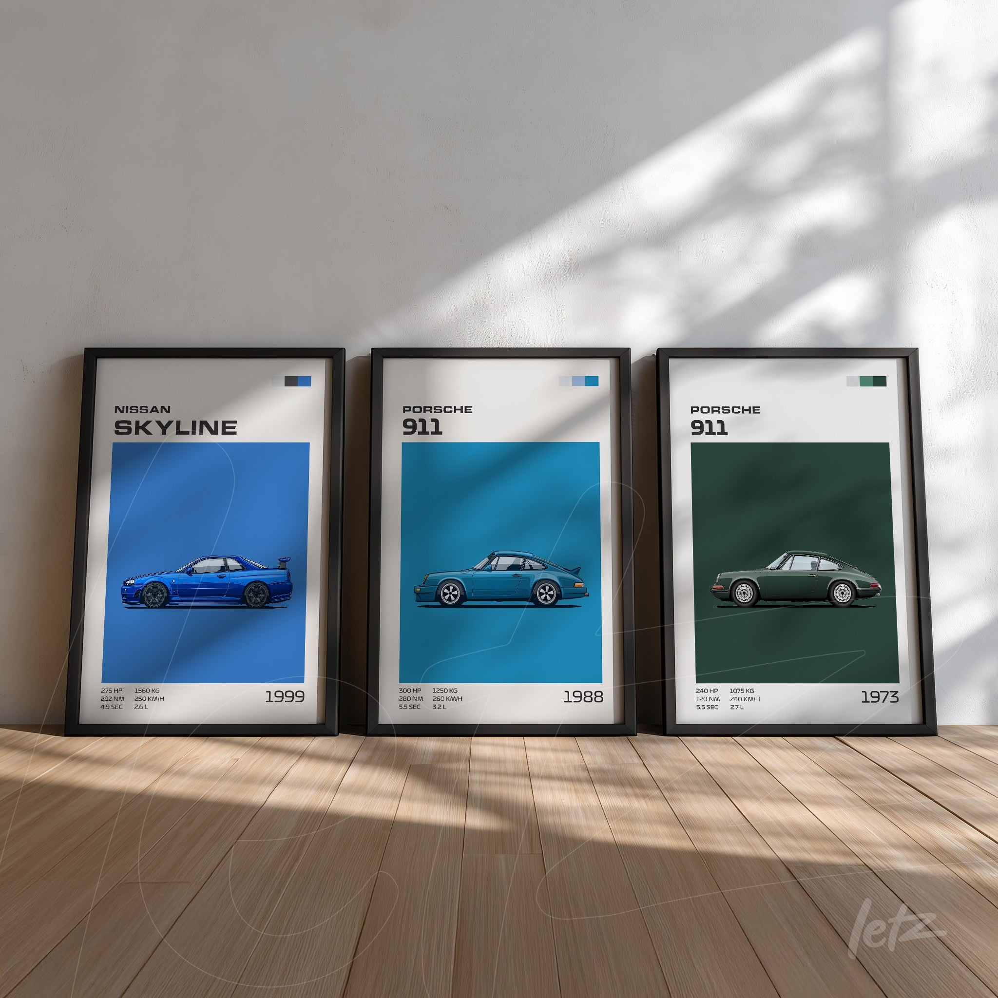 set of framed artworks featuring car illustrations including a blue 1999 nissan skyline in black frame, a green 1988 porsche 911, and a black framed 1973 porsche 911