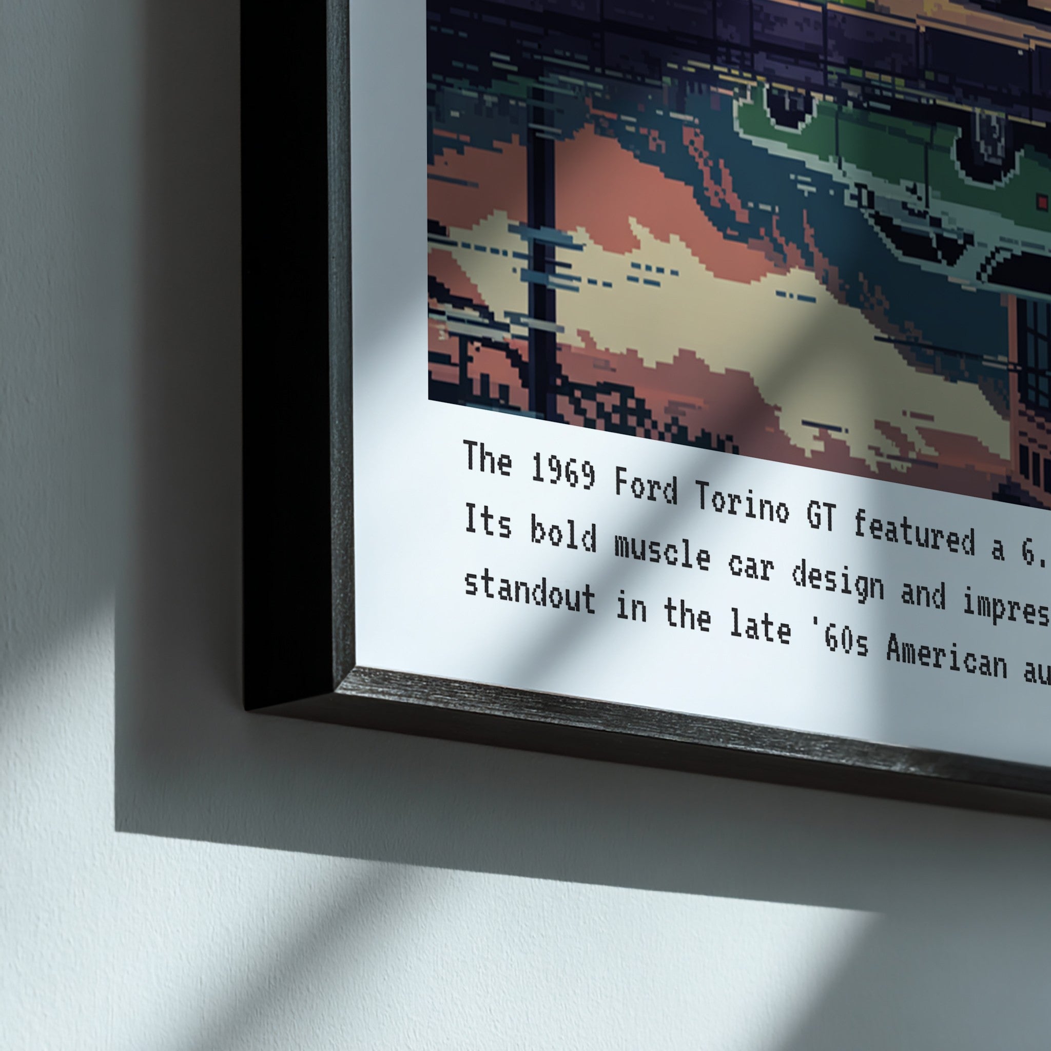 framed wall art featuring pixel art of a 1969 Ford Torino GT with a black frame, illuminated by shadows