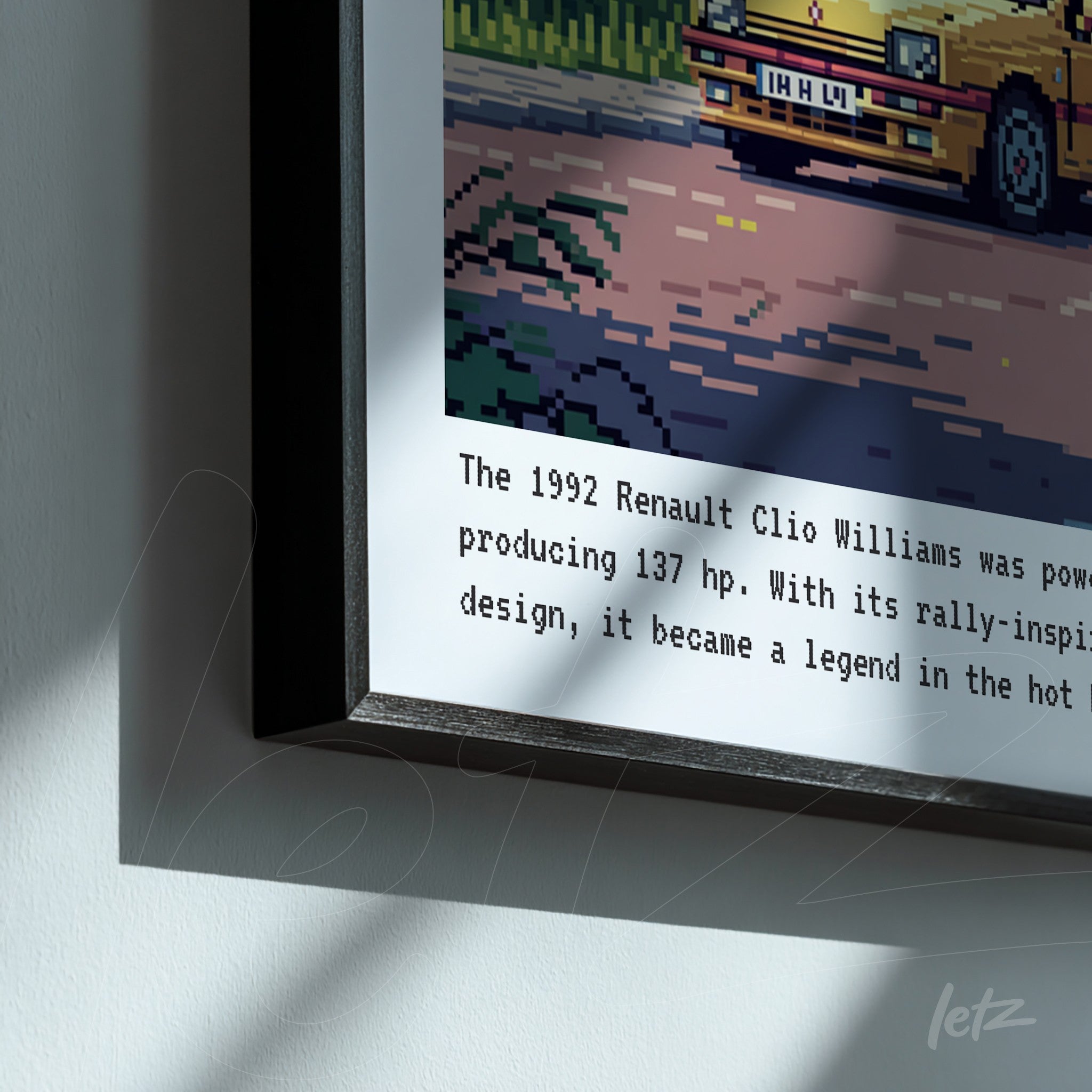framed pixel art of the 1992 Renault Clio Williams in black frame