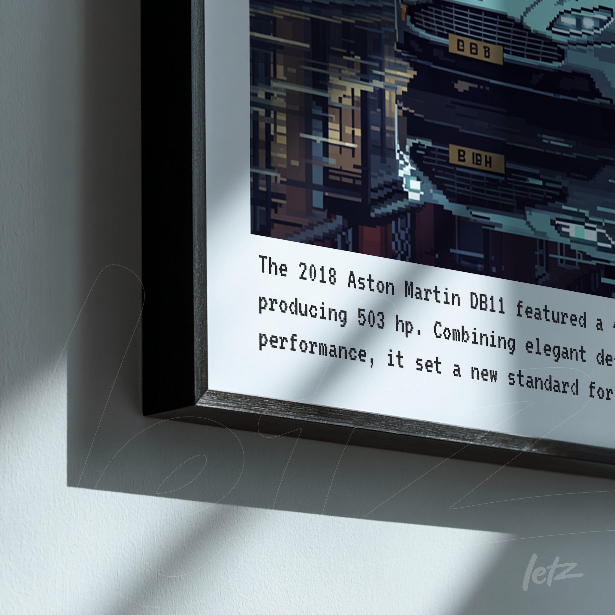 framed digital art showcasing an Aston Martin DB11 car with a black frame