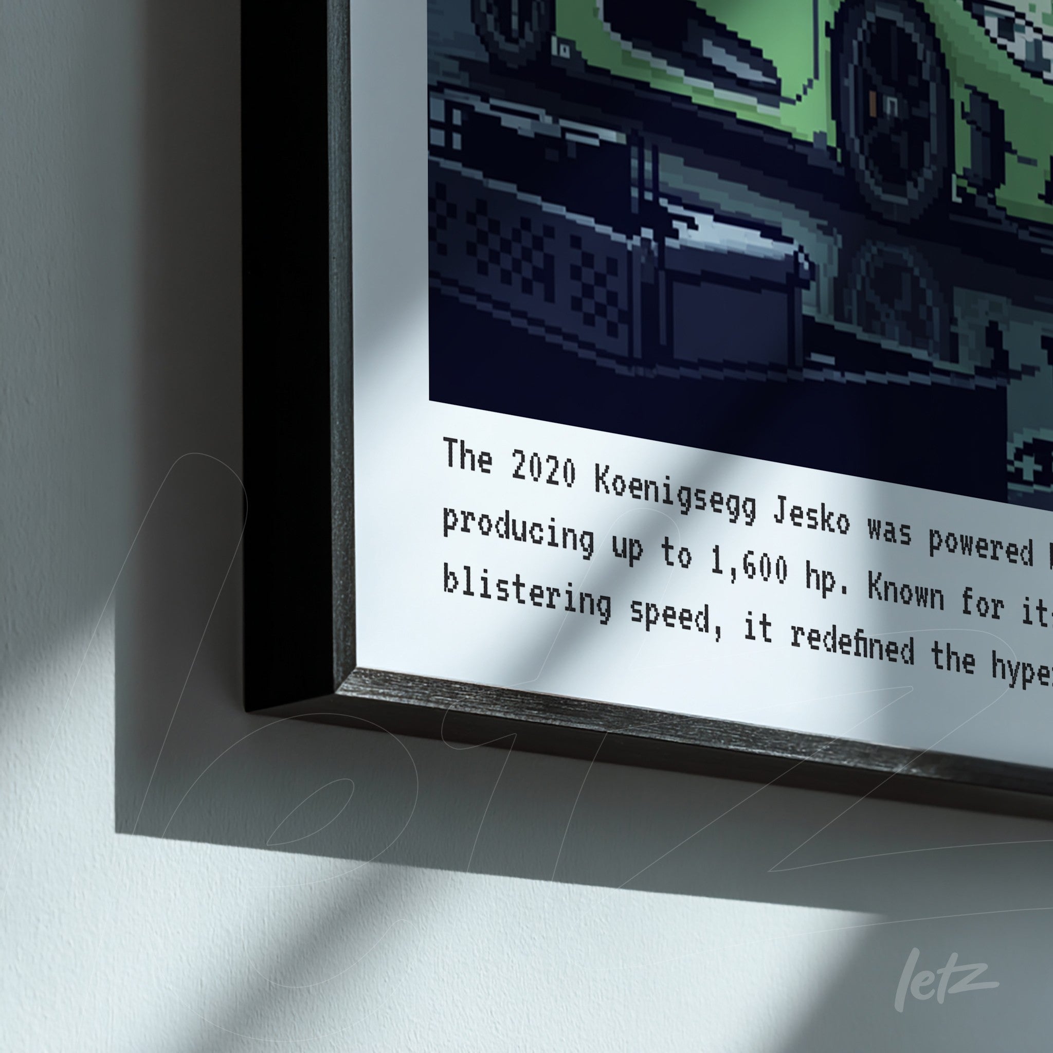 framed artwork featuring pixel art of a 2020 koenigsegg jesko on a white background
