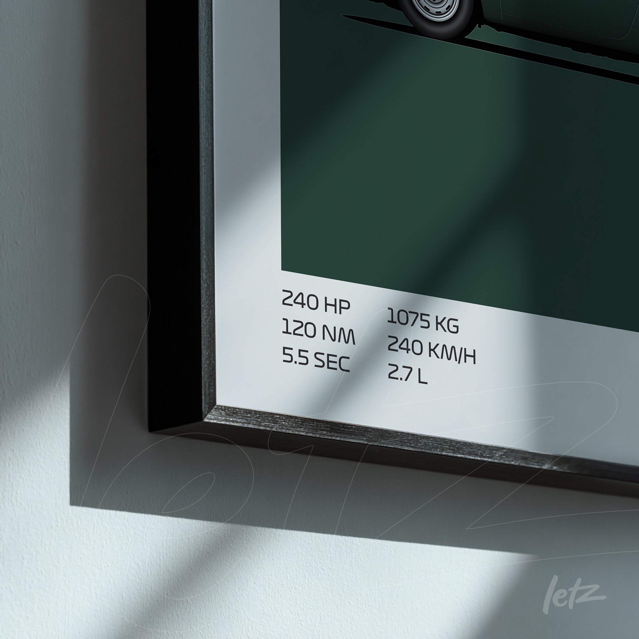 framed wall art featuring a stylized illustration of a car with dark green background and black frame