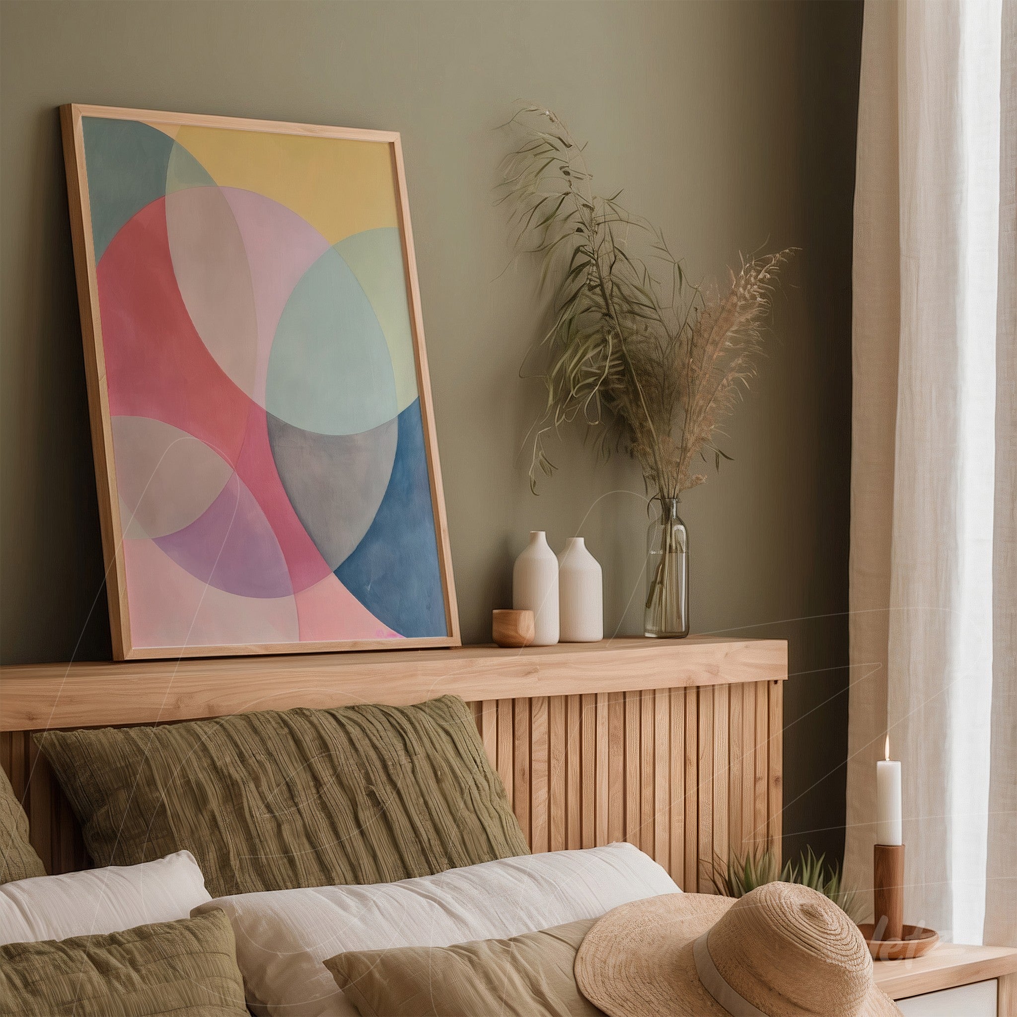 framed artwork featuring abstract geometric shapes in soft pastel colors, displayed on a wooden shelf against a gentle green background