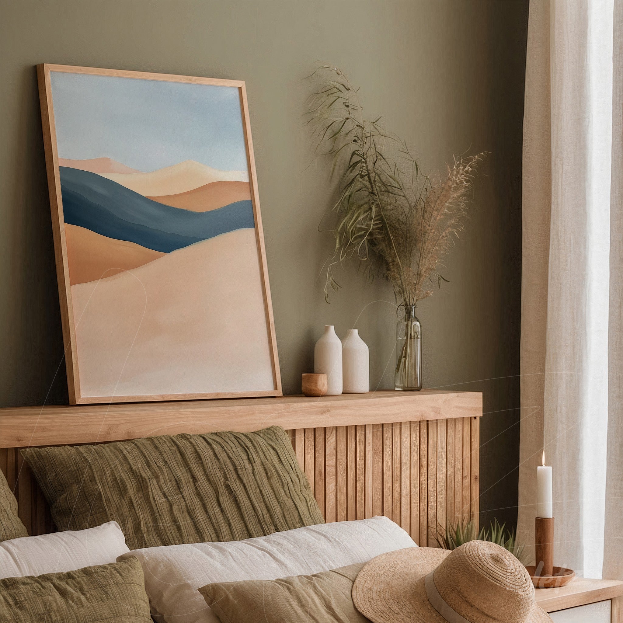 framed abstract landscape art in light wood frame against green wall