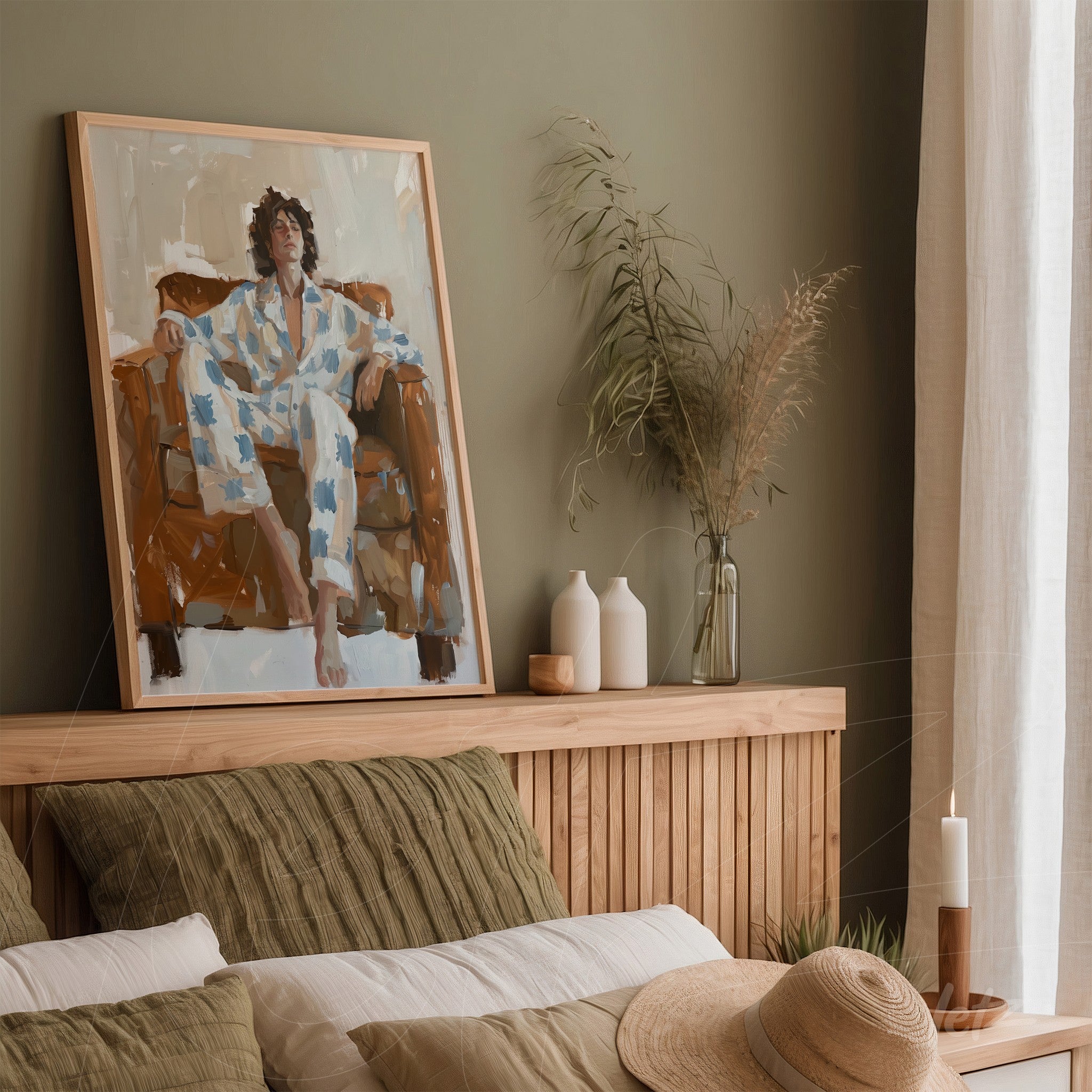 framed wall art featuring an abstract depiction of a human figure sitting on a couch against a green wall