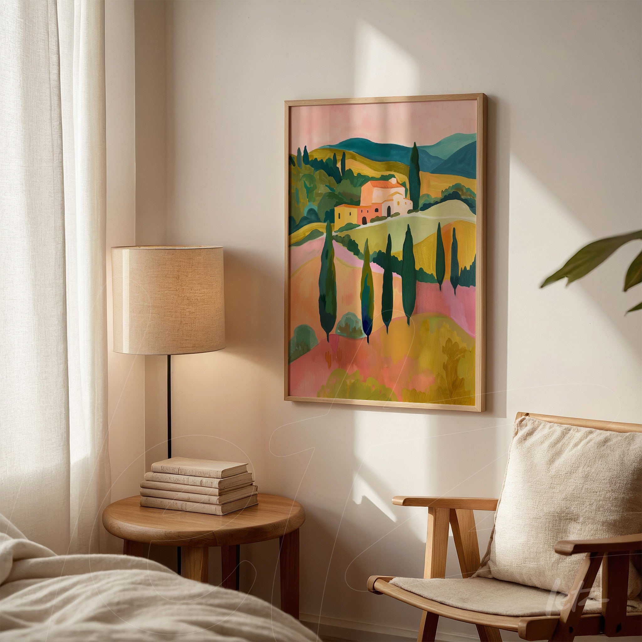 framed wall art featuring a pastel landscape of hills and villas against a light wall next to a floor lamp