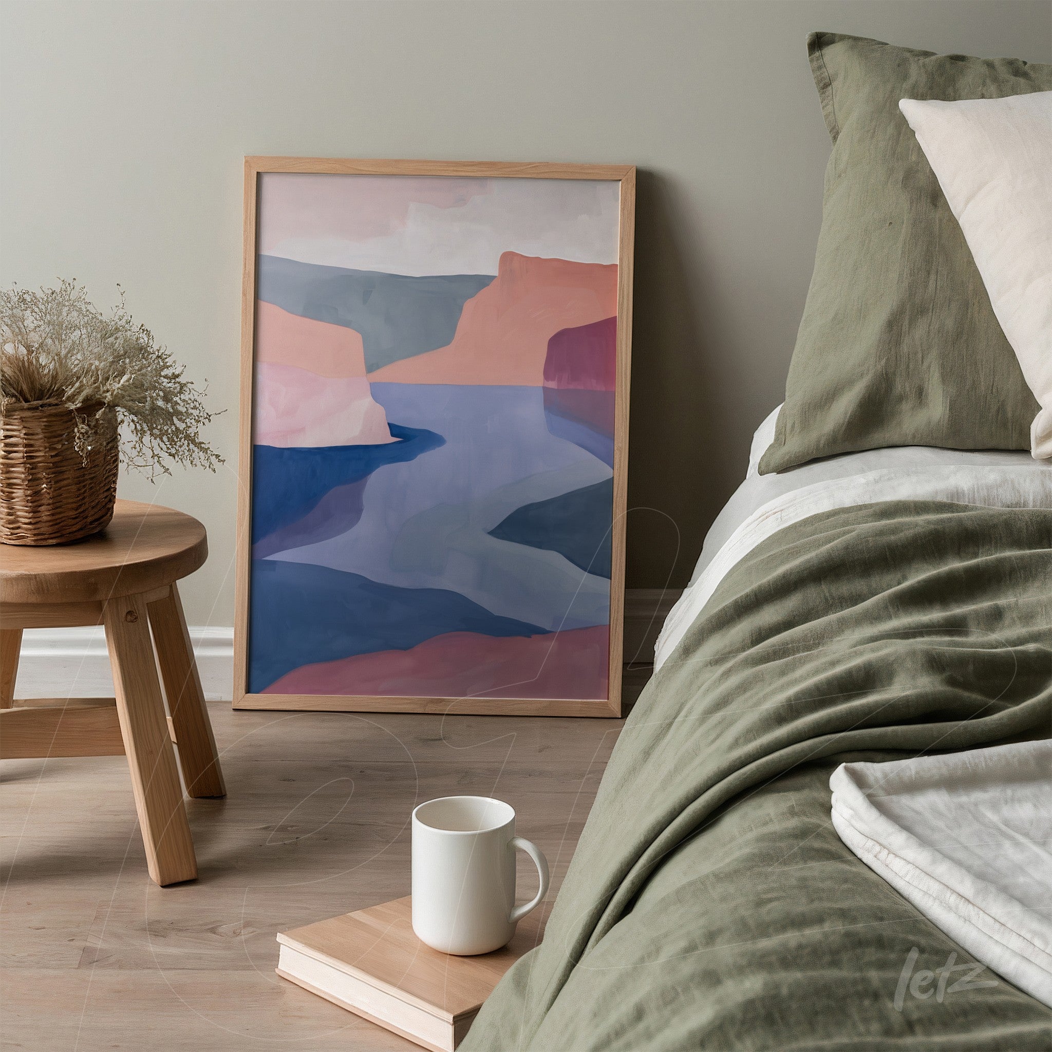 framed abstract landscape artwork with soft colors displayed next to a bed in a minimalistic setting