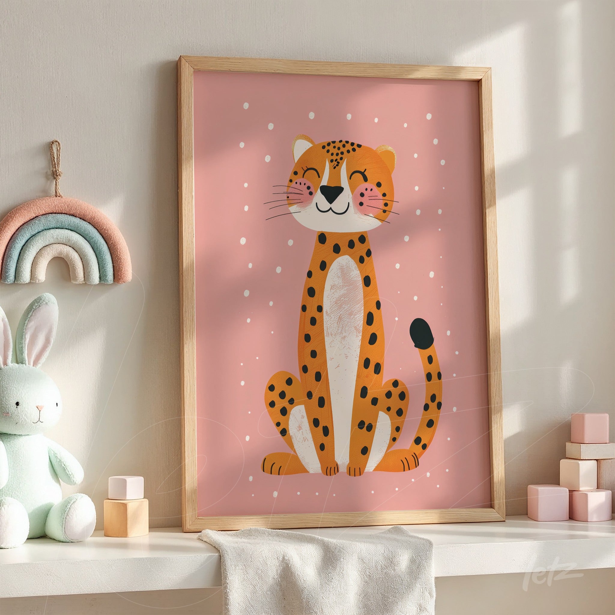 framed wall art of a smiling cheetah illustration with a light wood frame on pink background