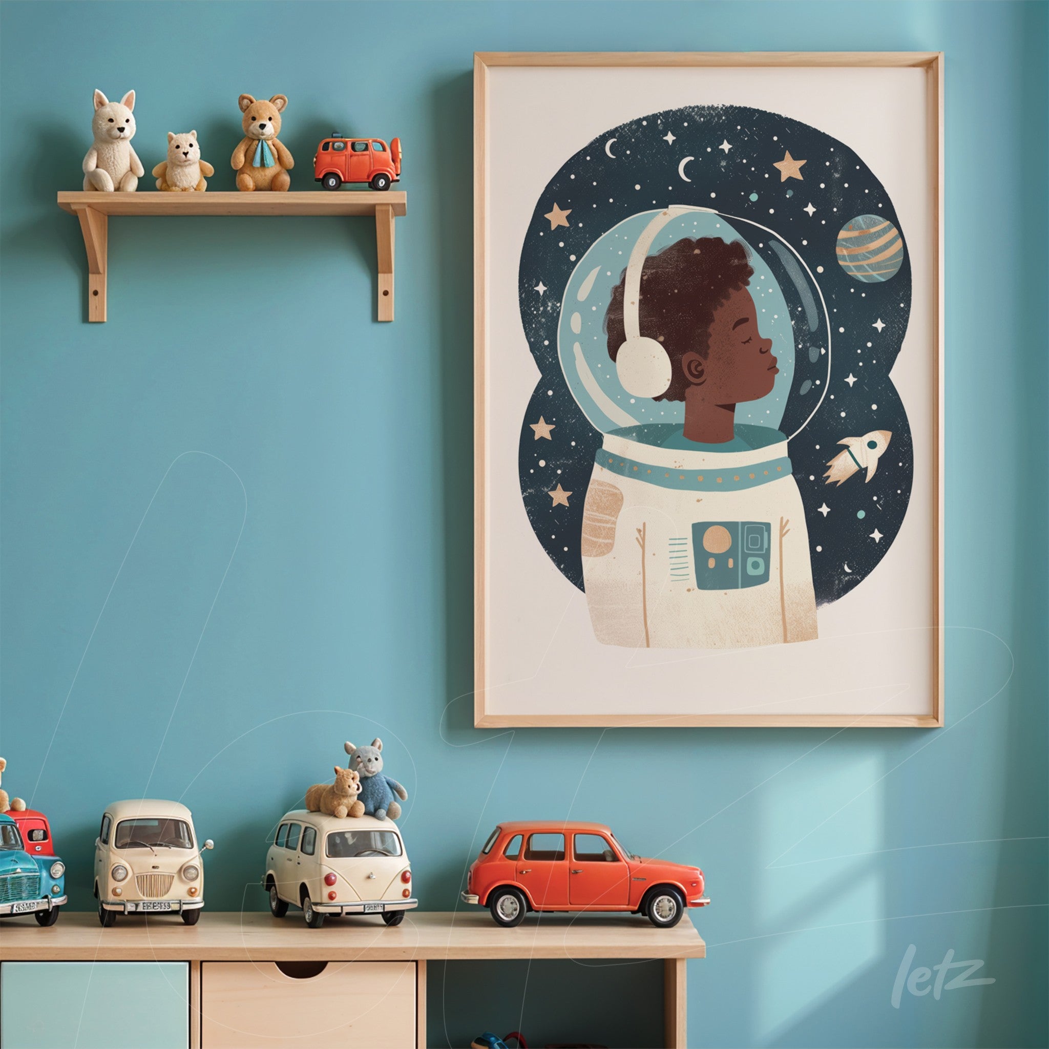 framed children's art of a black boy astronaut in a starry space background, light wood frame displayed on a blue wall with shelf and toys