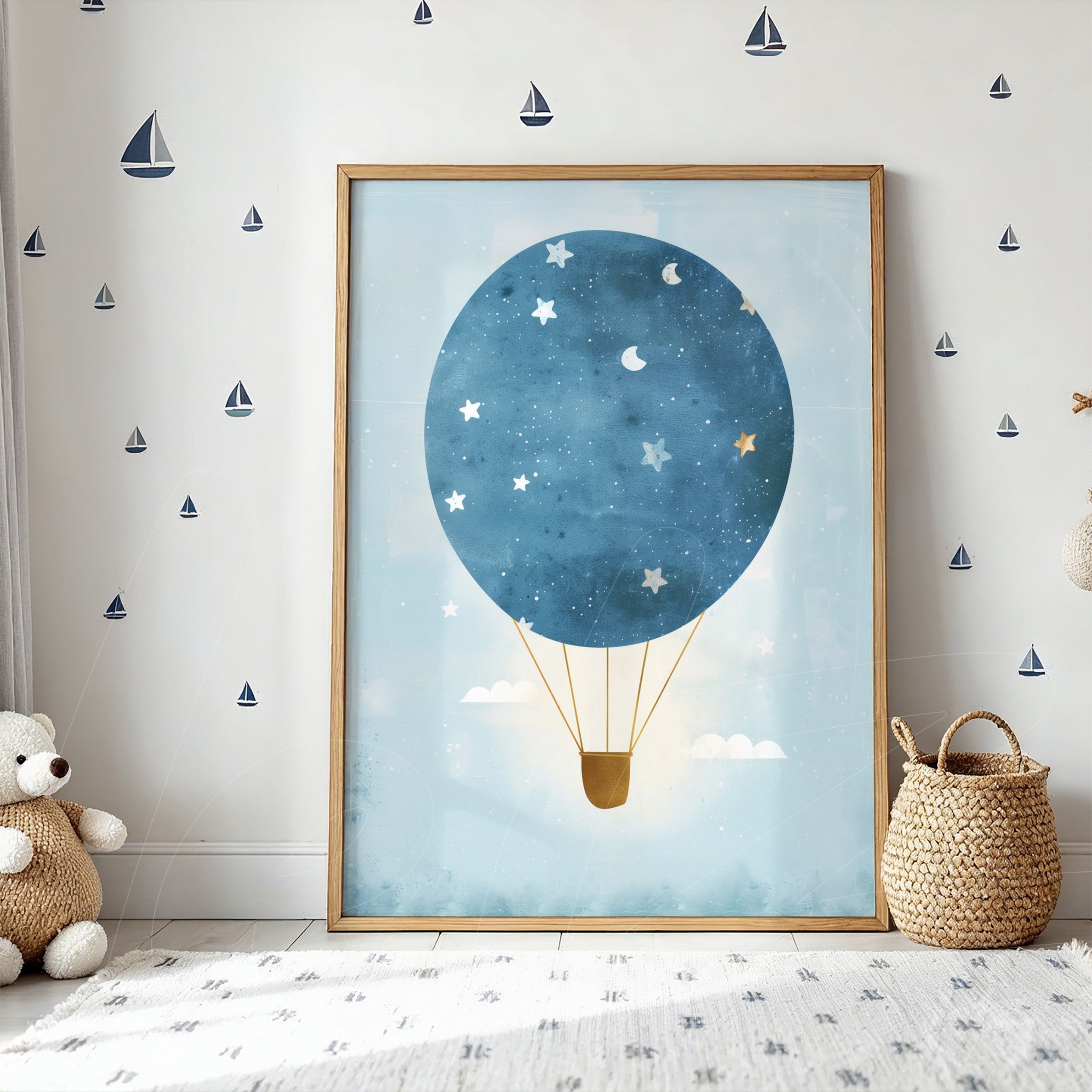 framed artwork featuring a hot air balloon in shades of blue and stars, light wood frame displayed on a light wall