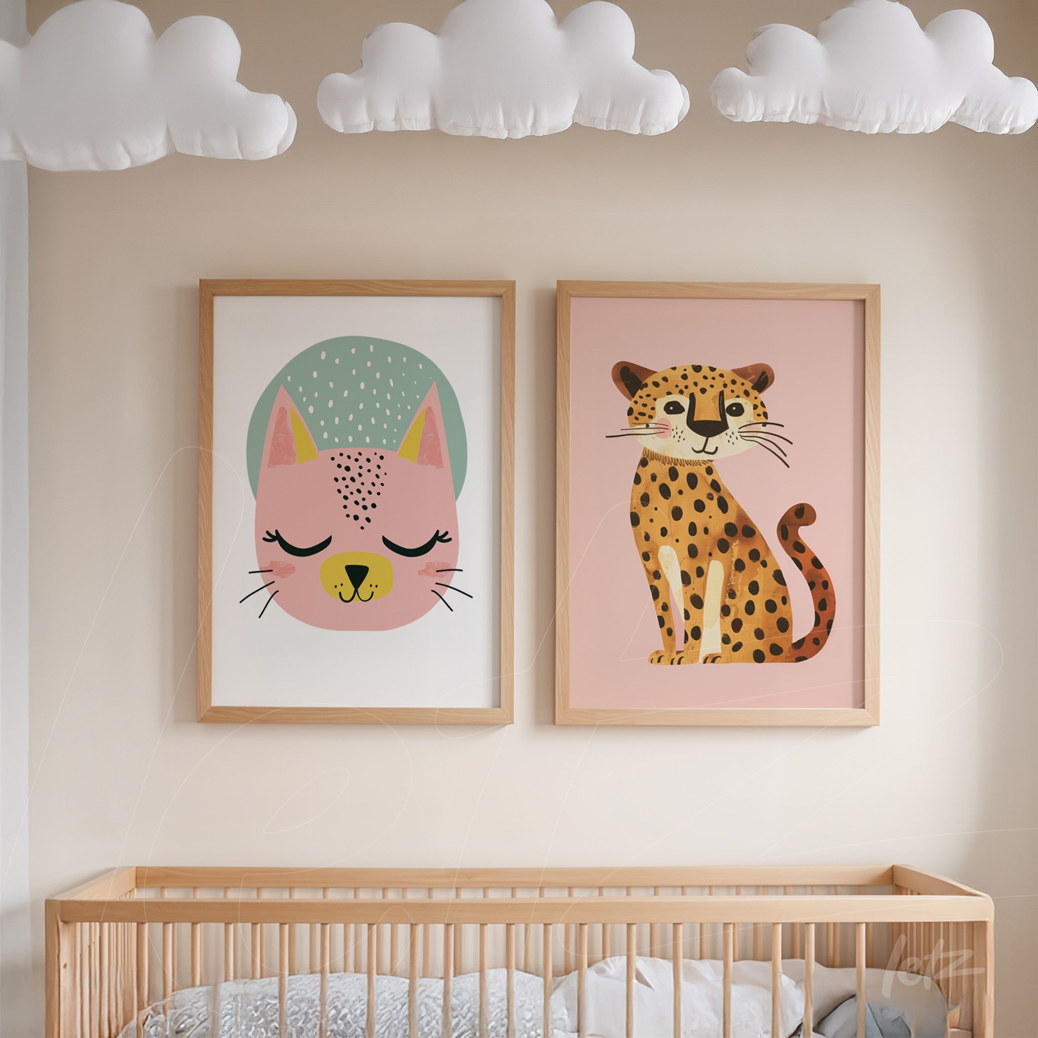 framed wall art composition featuring colorful animal illustrations of a pink cat and a leopard on light background with light wood frames
