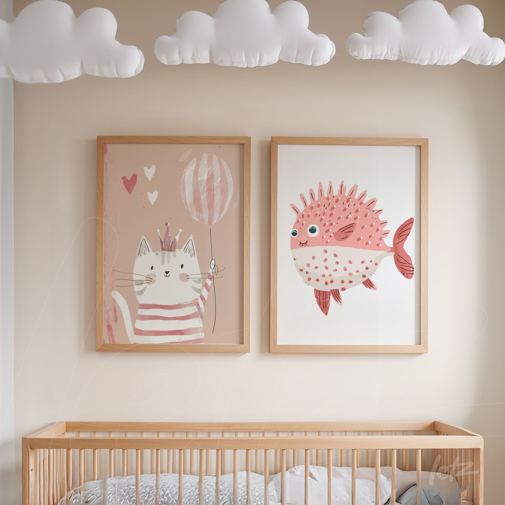 set of framed children's illustrations featuring a cat holding a balloon and a pink fish with light wood frames displayed on a neutral wall in a nursery setting