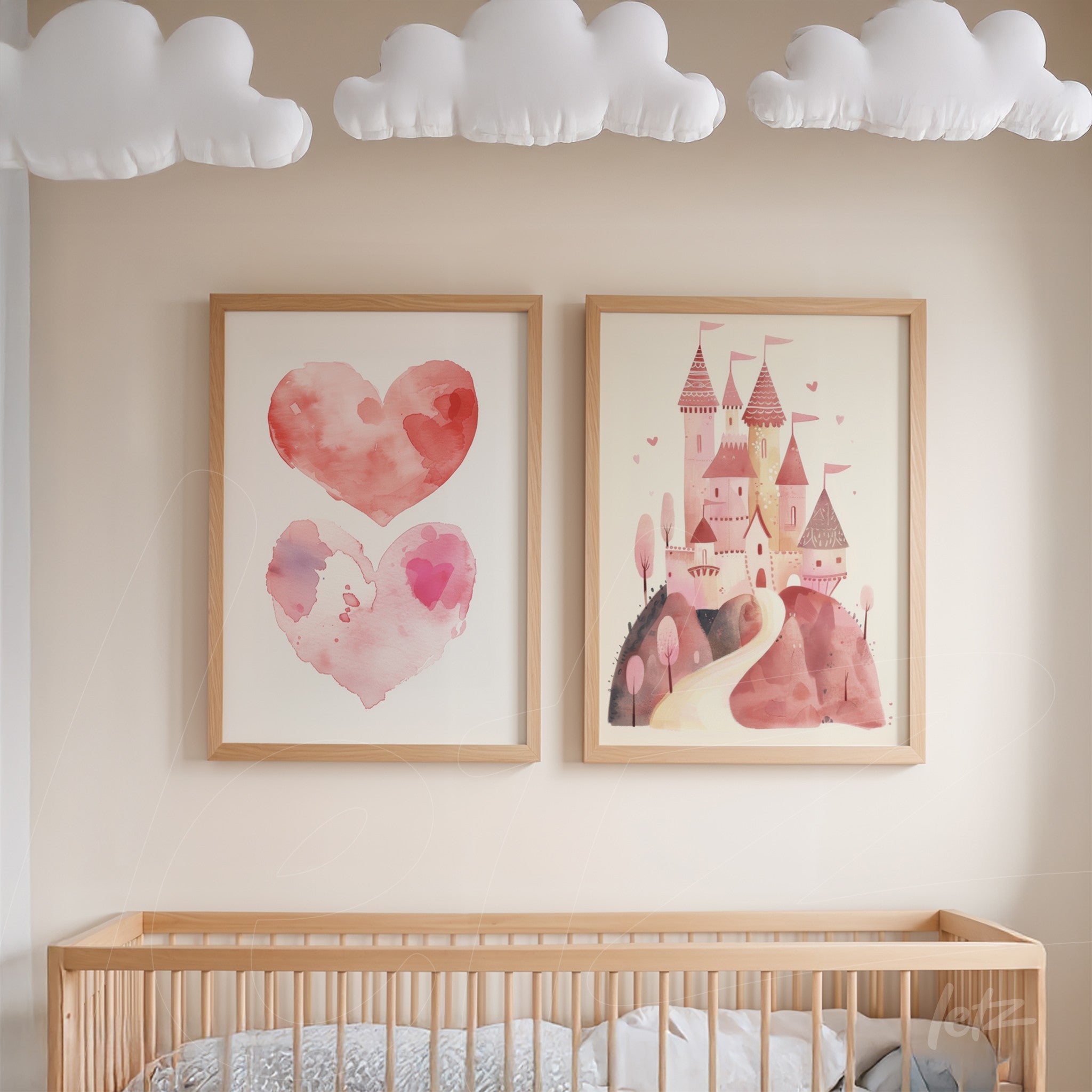 composition of framed art featuring pink hearts and a whimsical castle with light wood frame on neutral wall