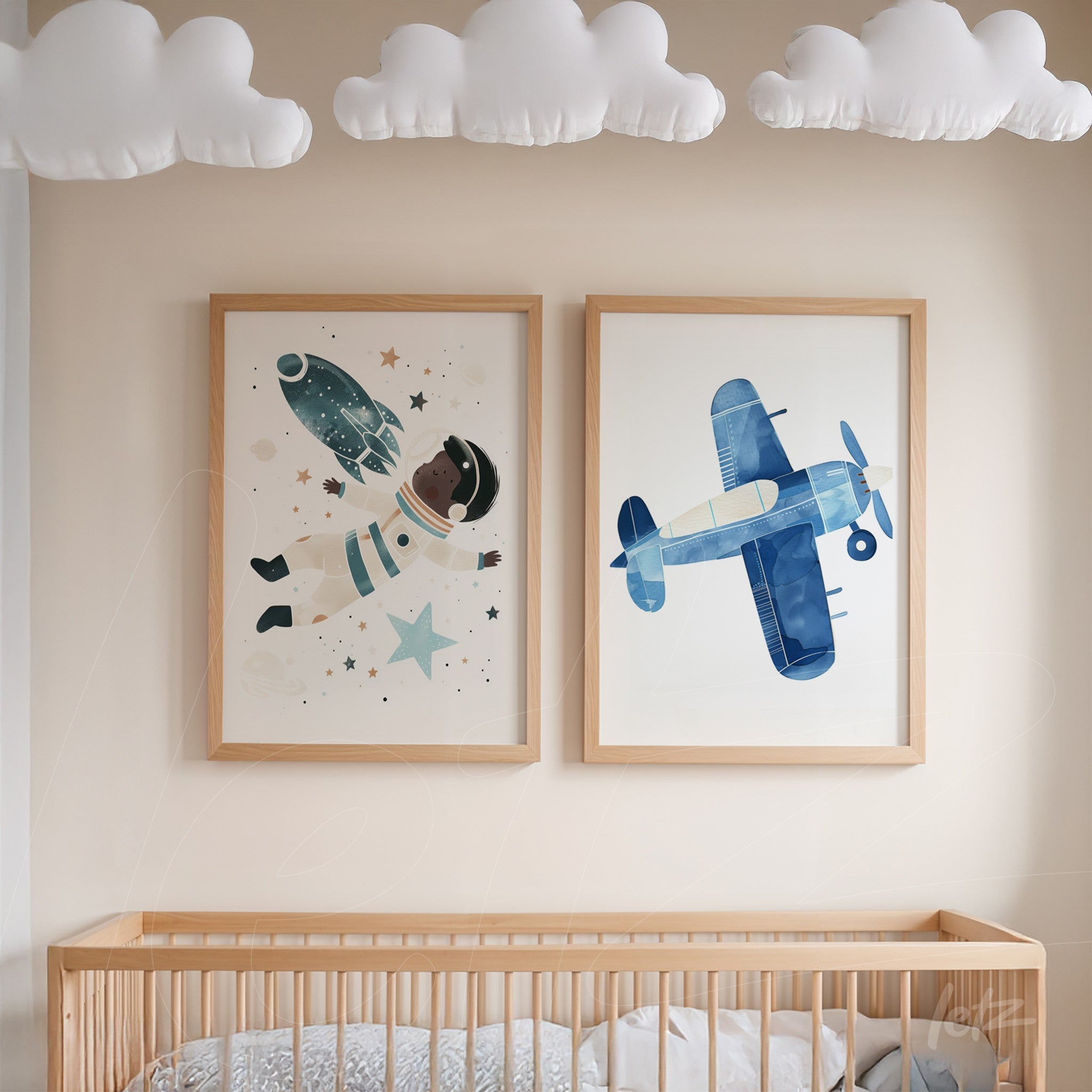 wall art featuring an astronaut and an airplane, framed in light wood, displayed on a neutral wall