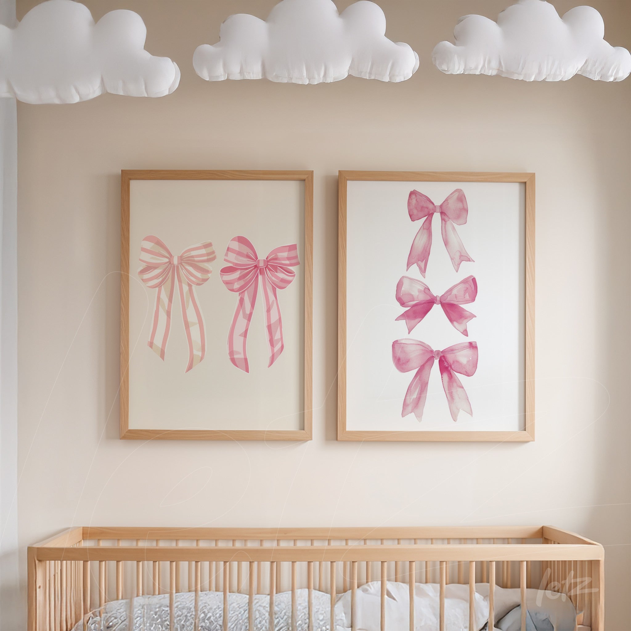 set of framed artworks featuring pink bows in light wood frames displayed on a neutral wall in a nursery