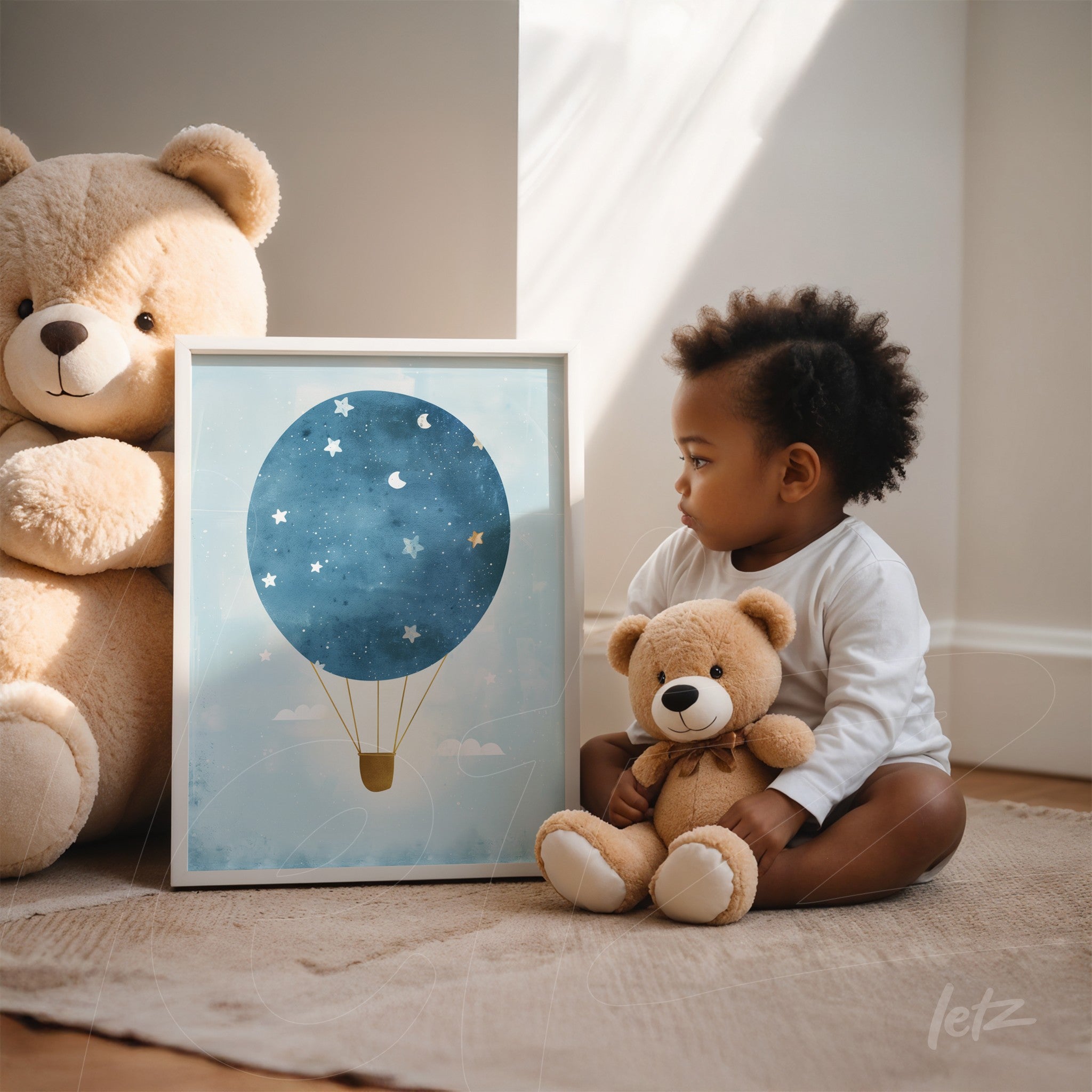 framed artwork of a hot air balloon in shades of blue with stars, displayed next to a child holding a teddy bear