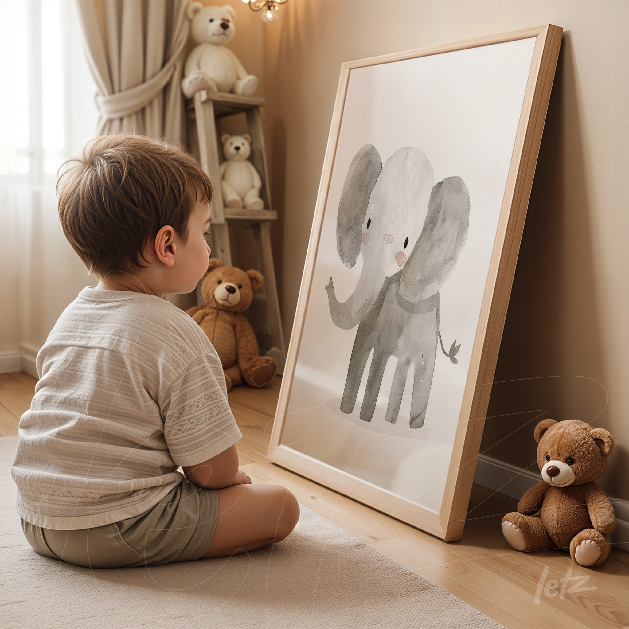 framed artwork featuring a cute elephant illustration in light wooden frame displayed beside a child sitting on the floor surrounded by teddy bears