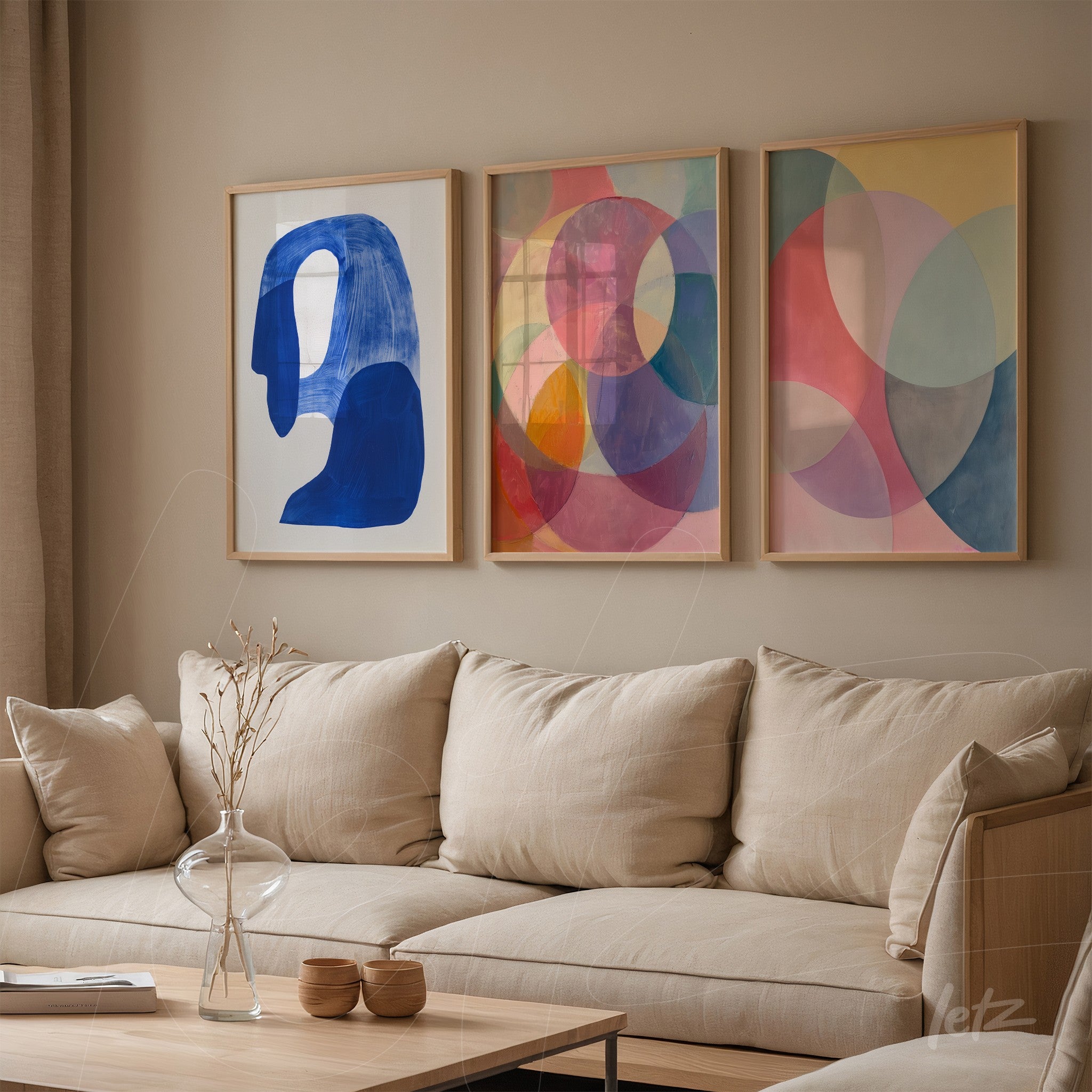 series of framed wall art featuring abstract designs with geometric shapes and soft colors on a neutral wall