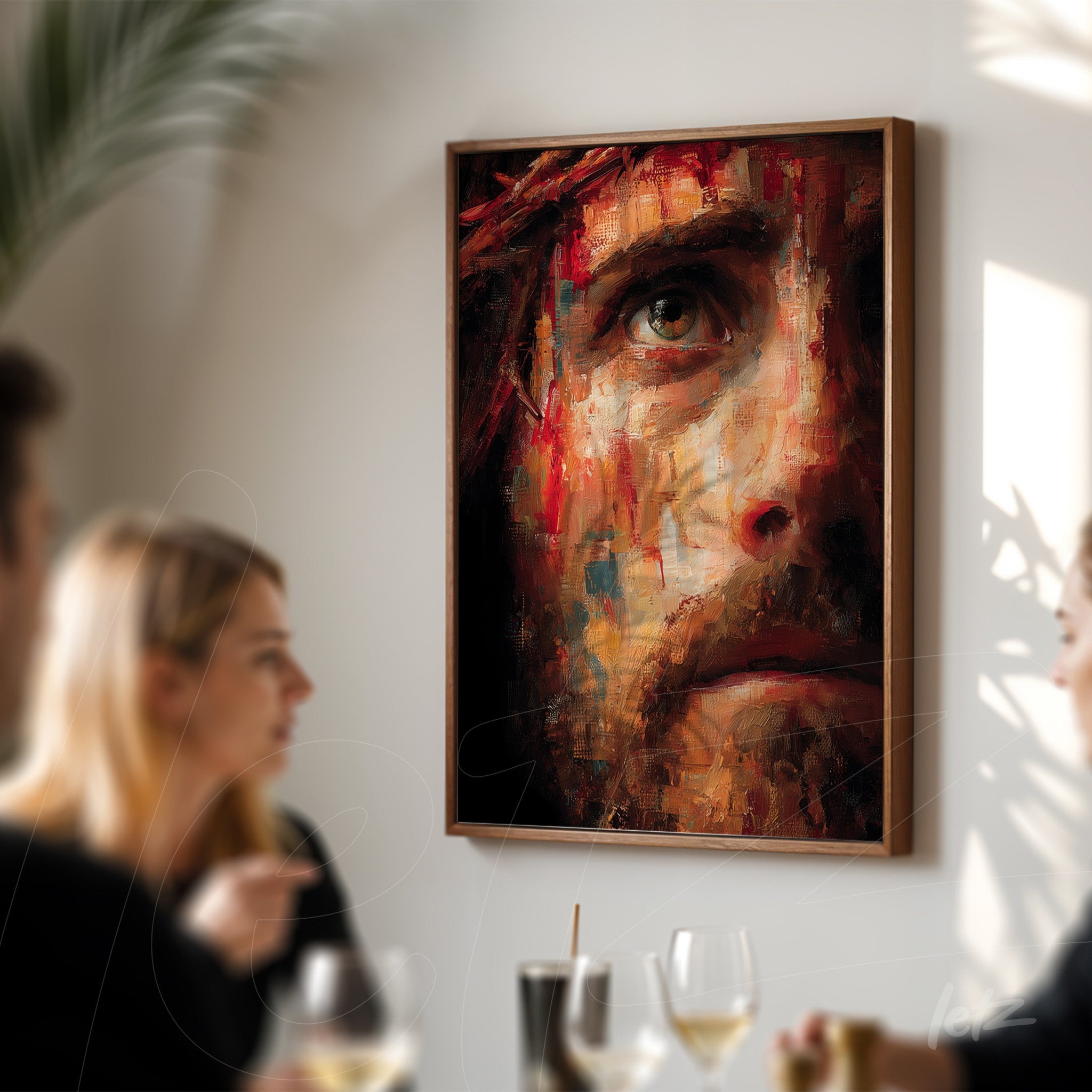 framed art featuring an expressive human face portrayed in dark tones with a light wood frame