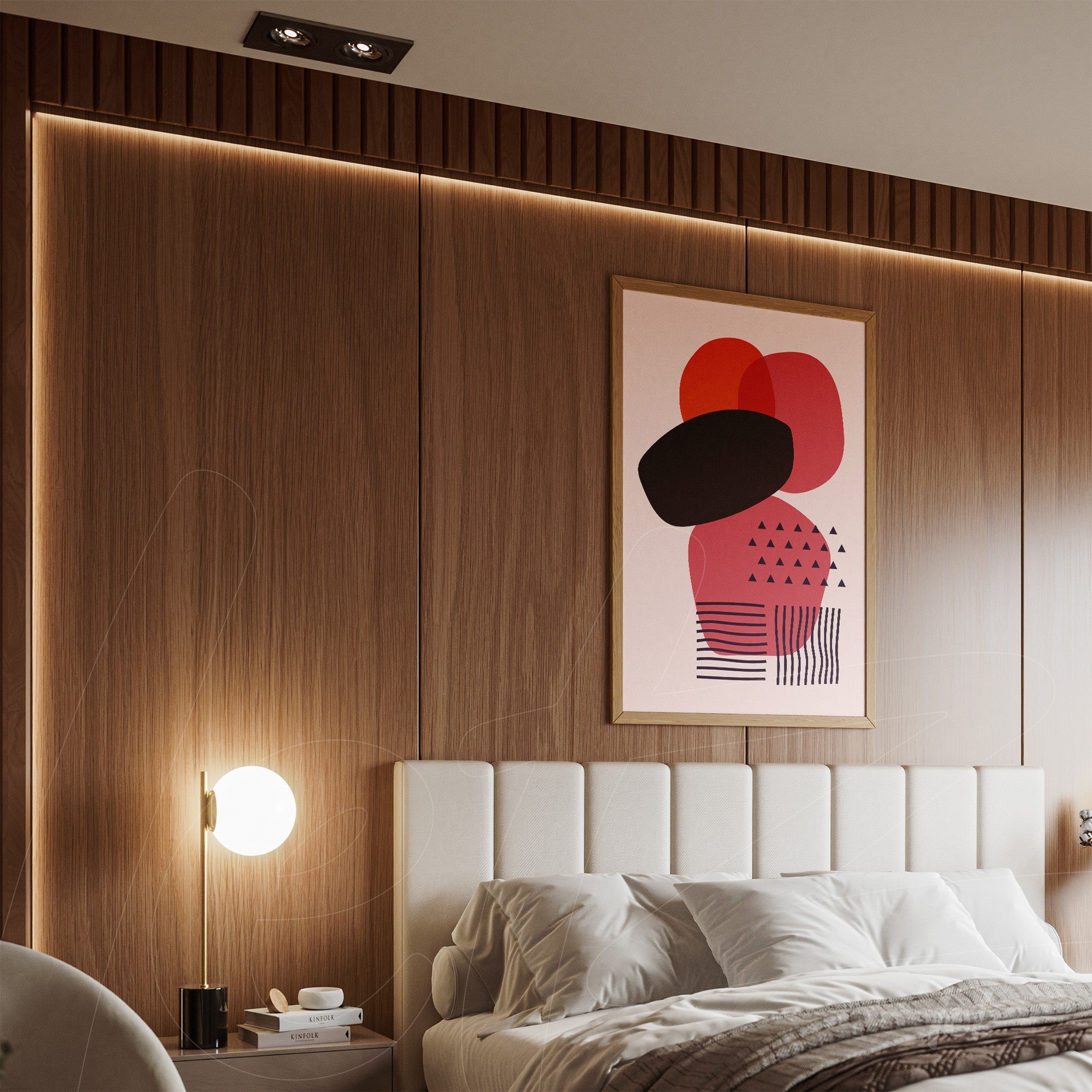 abstract art in red and black tones on a pink background with light wood frame displayed in a modern bedroom