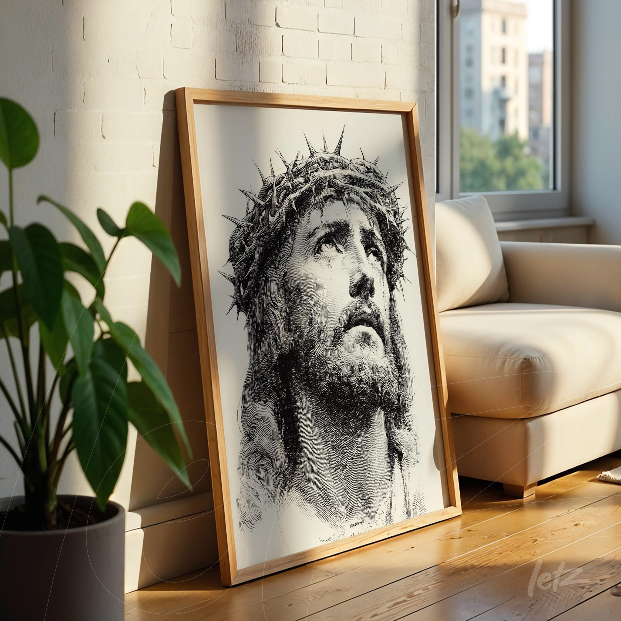 framed black and white portrait of jesus christ with thorn crown in light wood frame