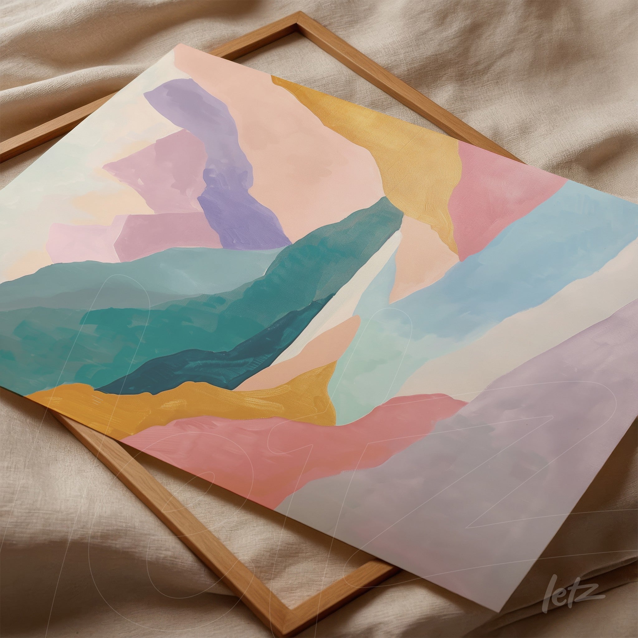 abstract wall art in pastel colors displayed on a light surface with a natural wood frame