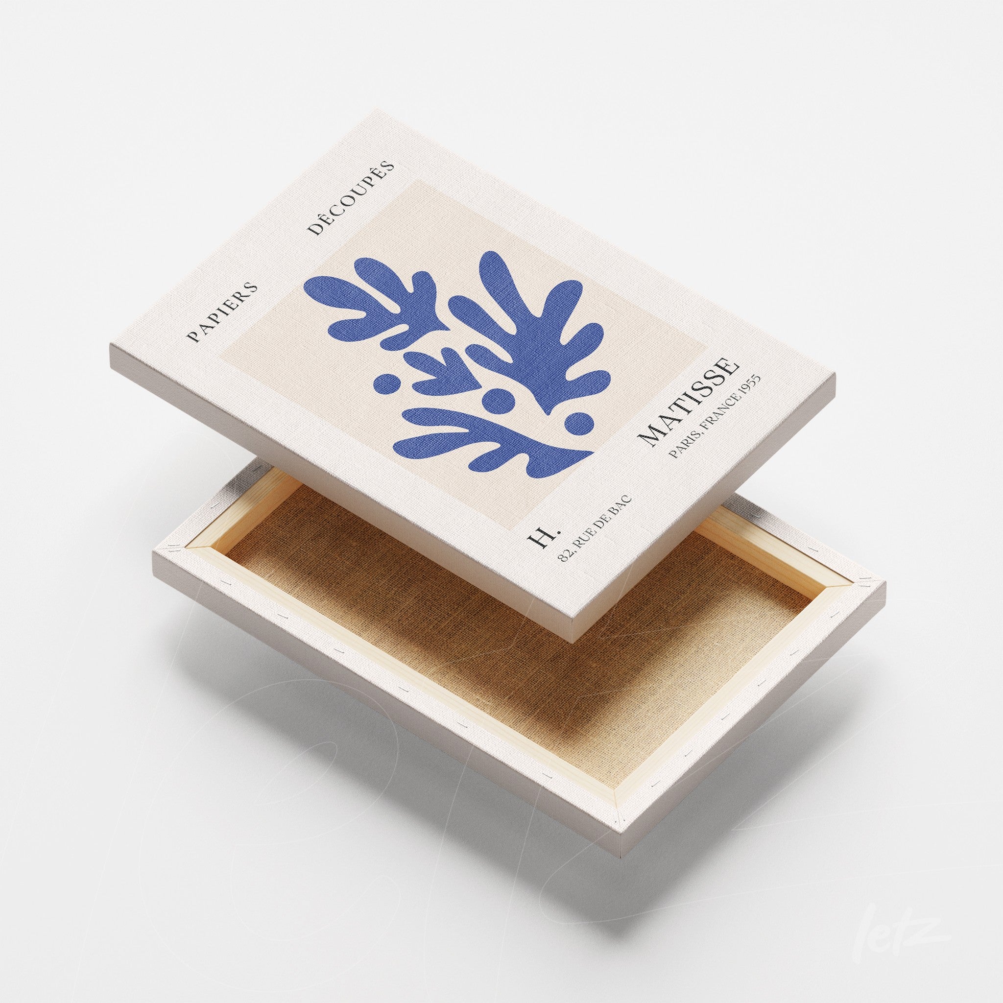 art box featuring paper cutout design with light background and blue leaves