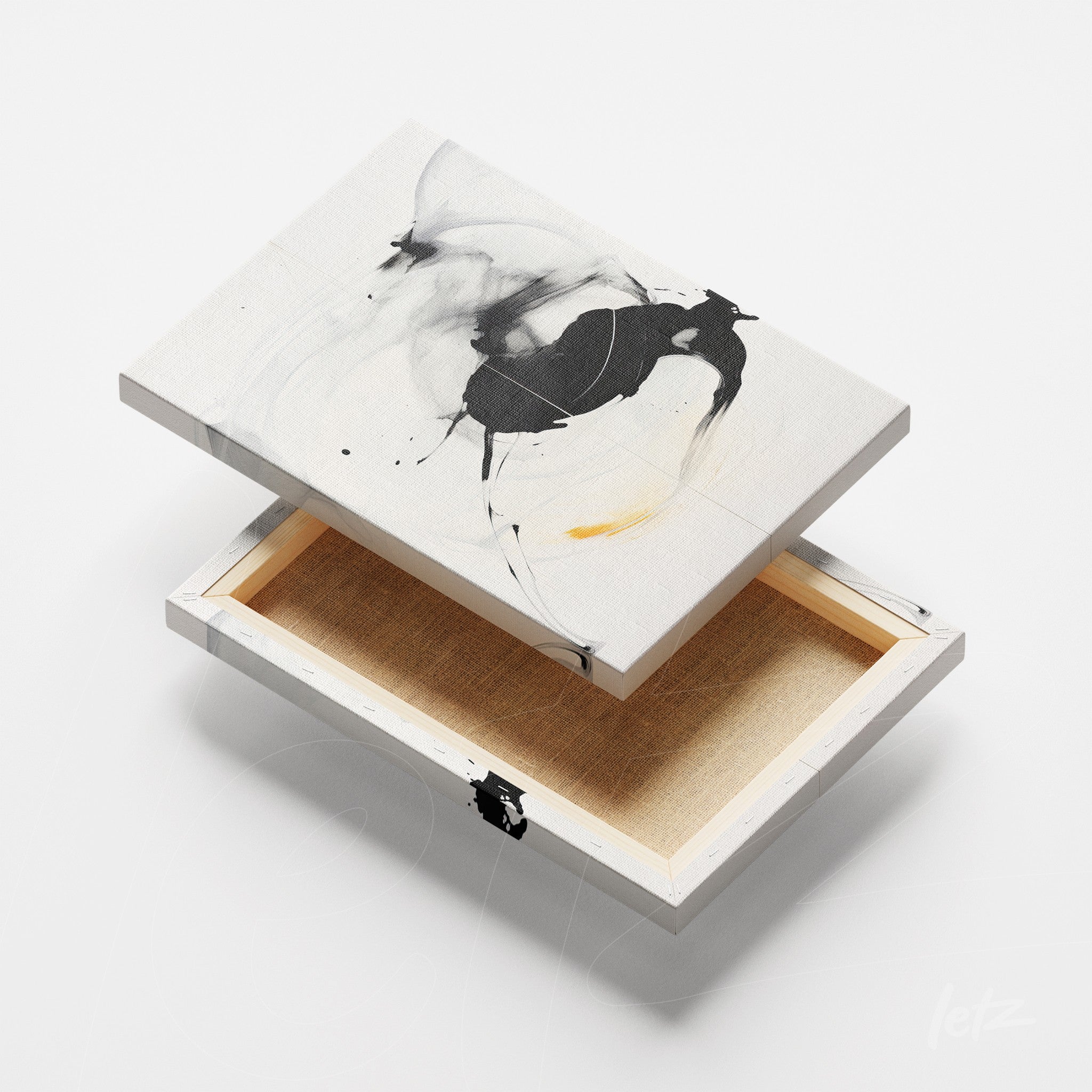 canvas wall art featuring abstract design in black, white, and touches of yellow displayed at an angle on white background