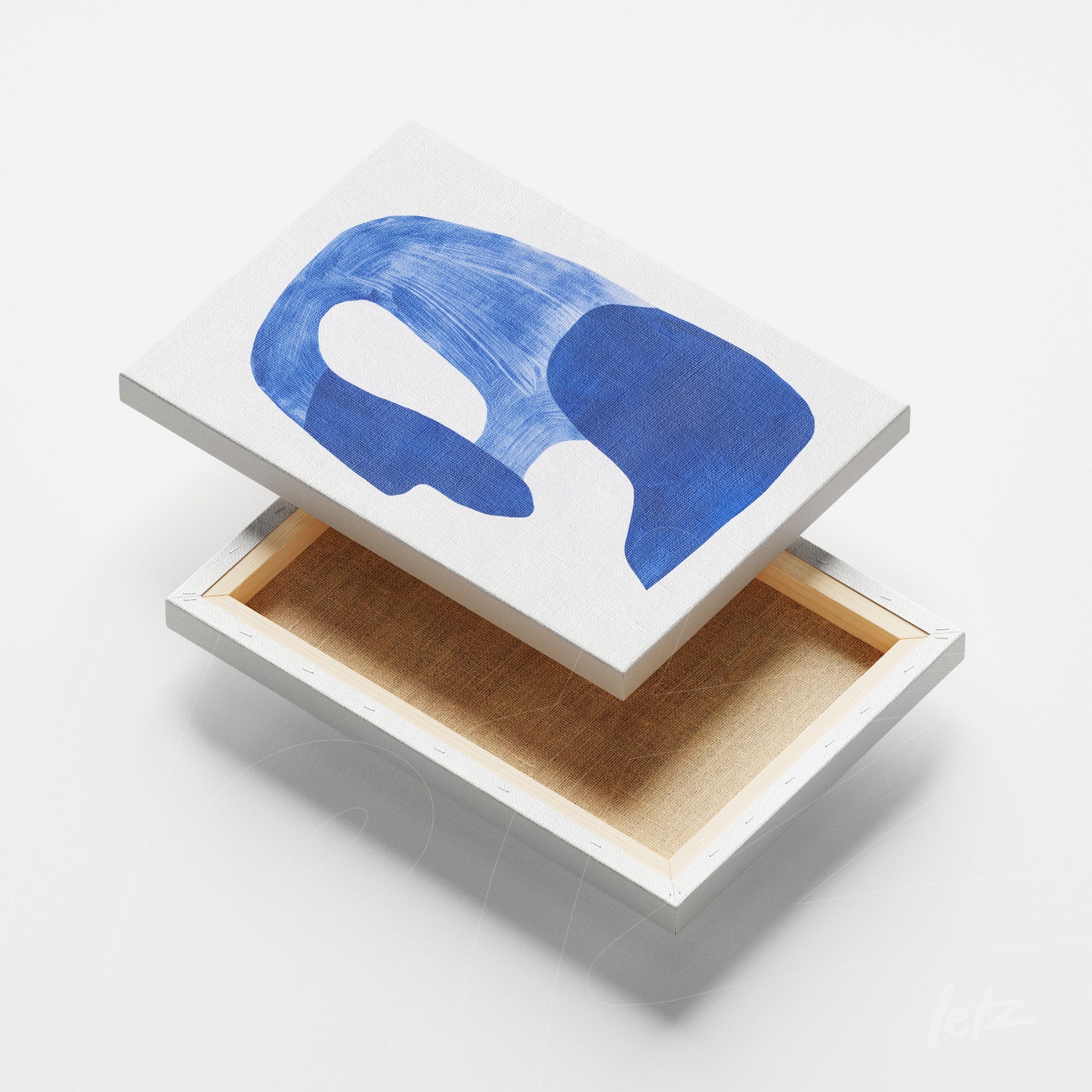 canvas wall art featuring abstract design in shades of blue on light background
