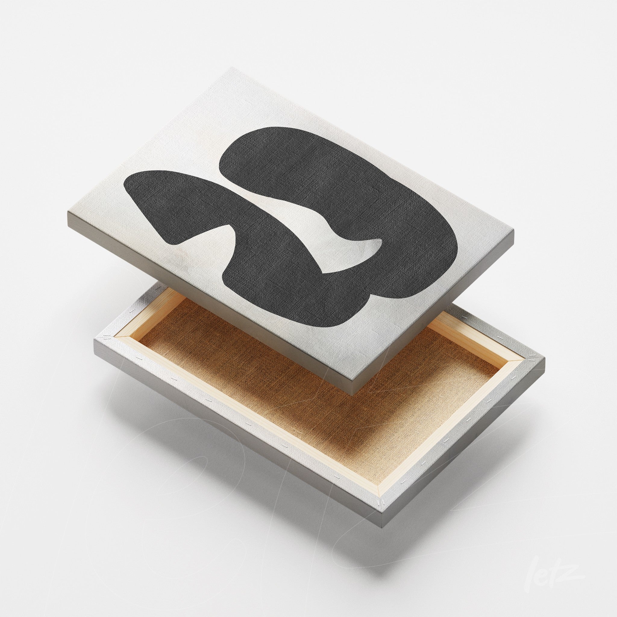 canvas art with abstract black design on silver background