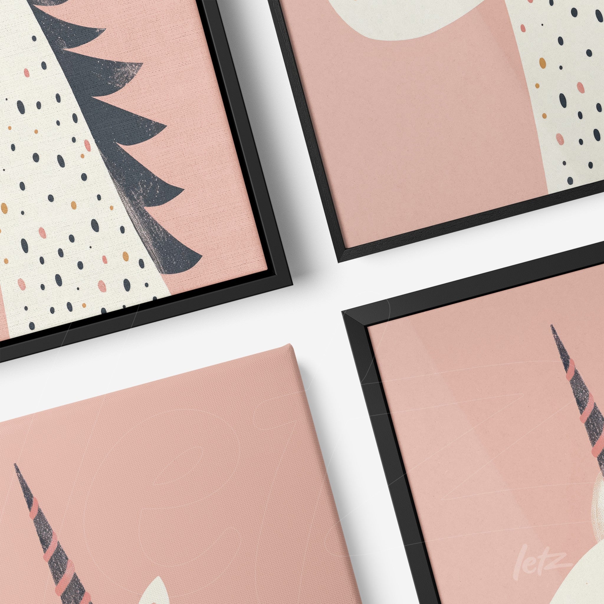 composition of framed unicorn art in black frame set against a light pink background