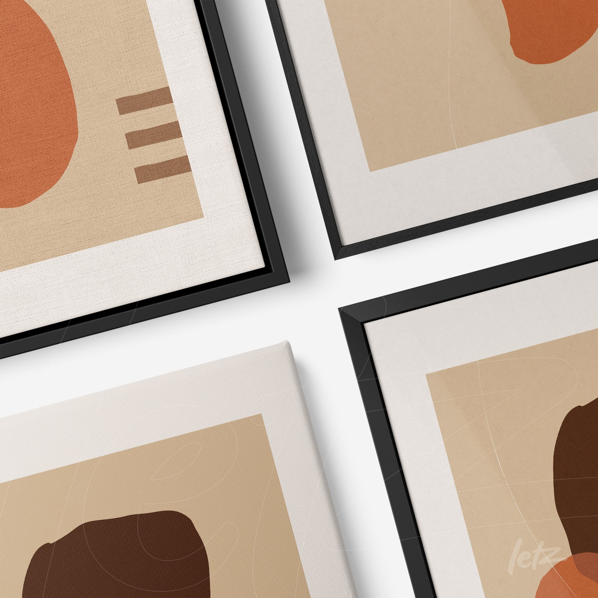 composition of abstract artworks with black frames and canvas, featuring geometric shapes in earthy tones on a beige background