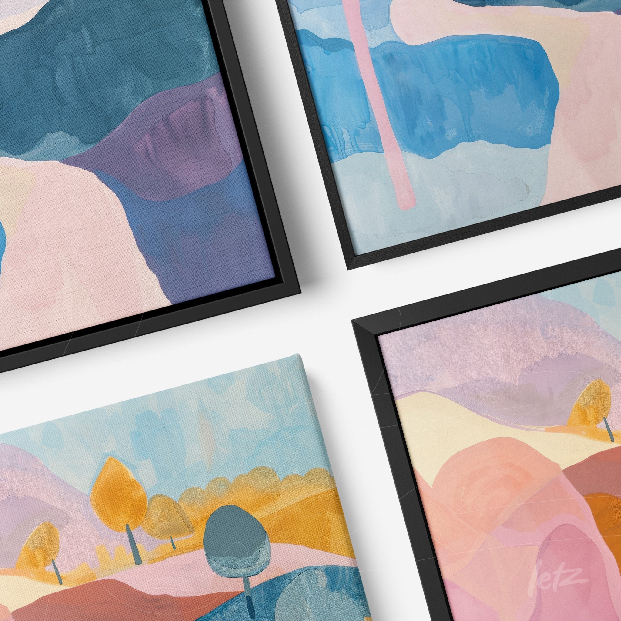collection of framed artwork featuring abstract landscapes in shades of blue, pink, and yellow