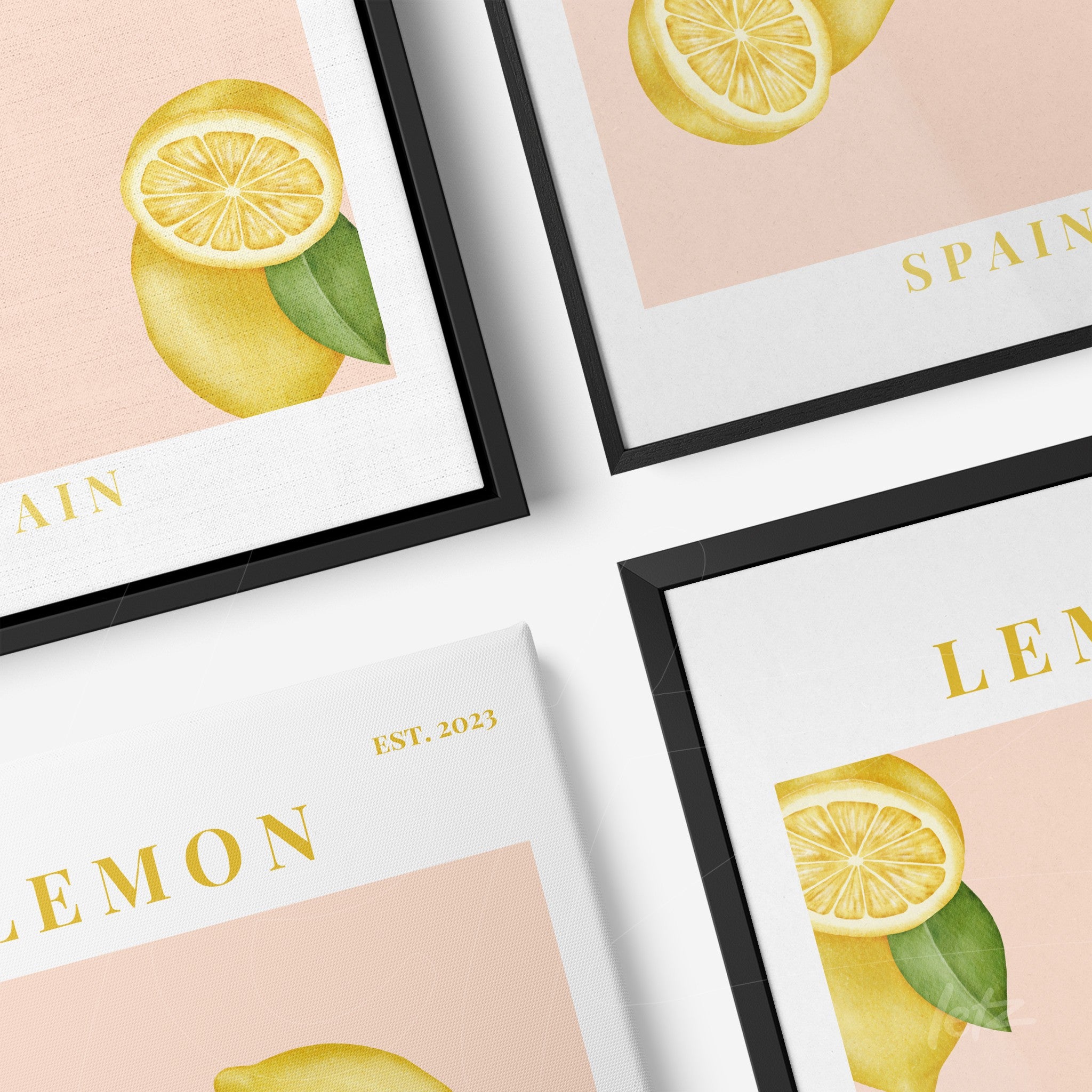 decorative wall art featuring lemons on a light pink background with black frame and gold accents