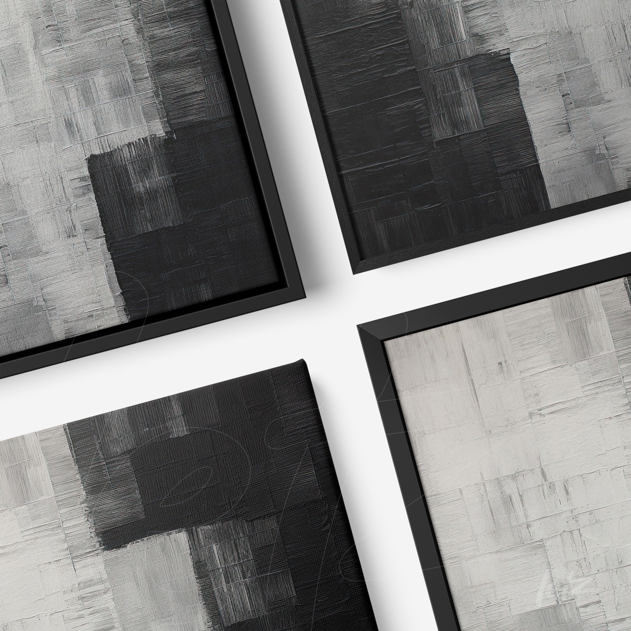 collection of abstract wall art in shades of black and gray with sleek black frames
