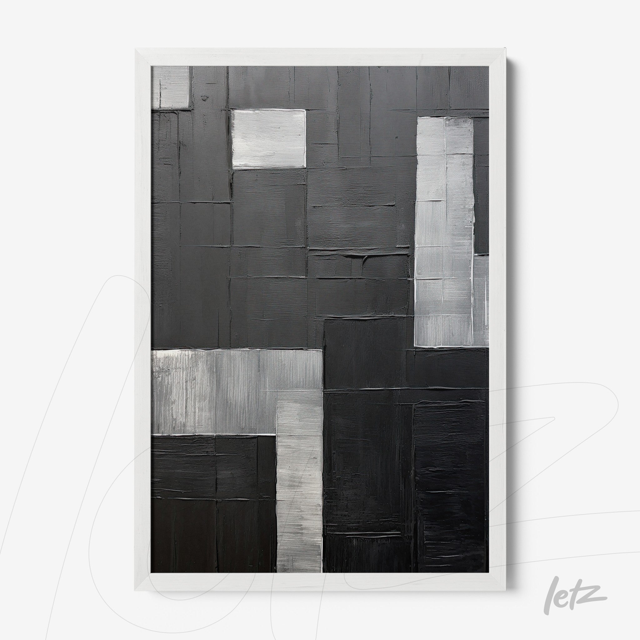 abstract wall art in shades of black and gray with textured relief, framed in white
