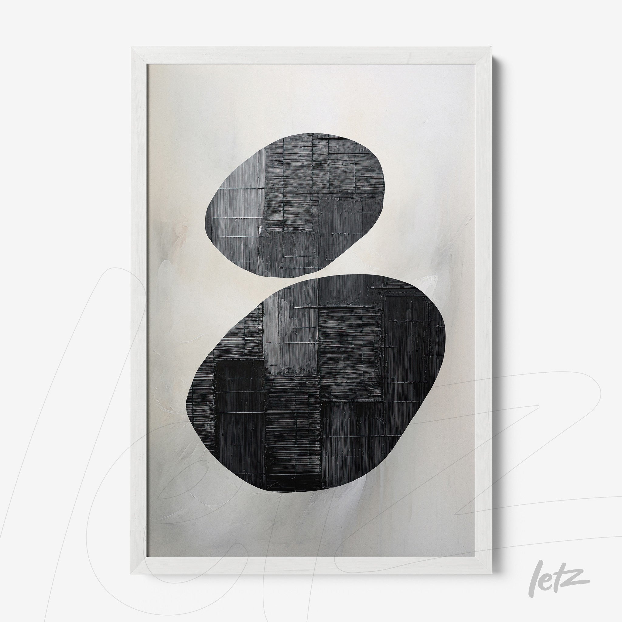 abstract wall art featuring black oval shapes on a light background in a white frame