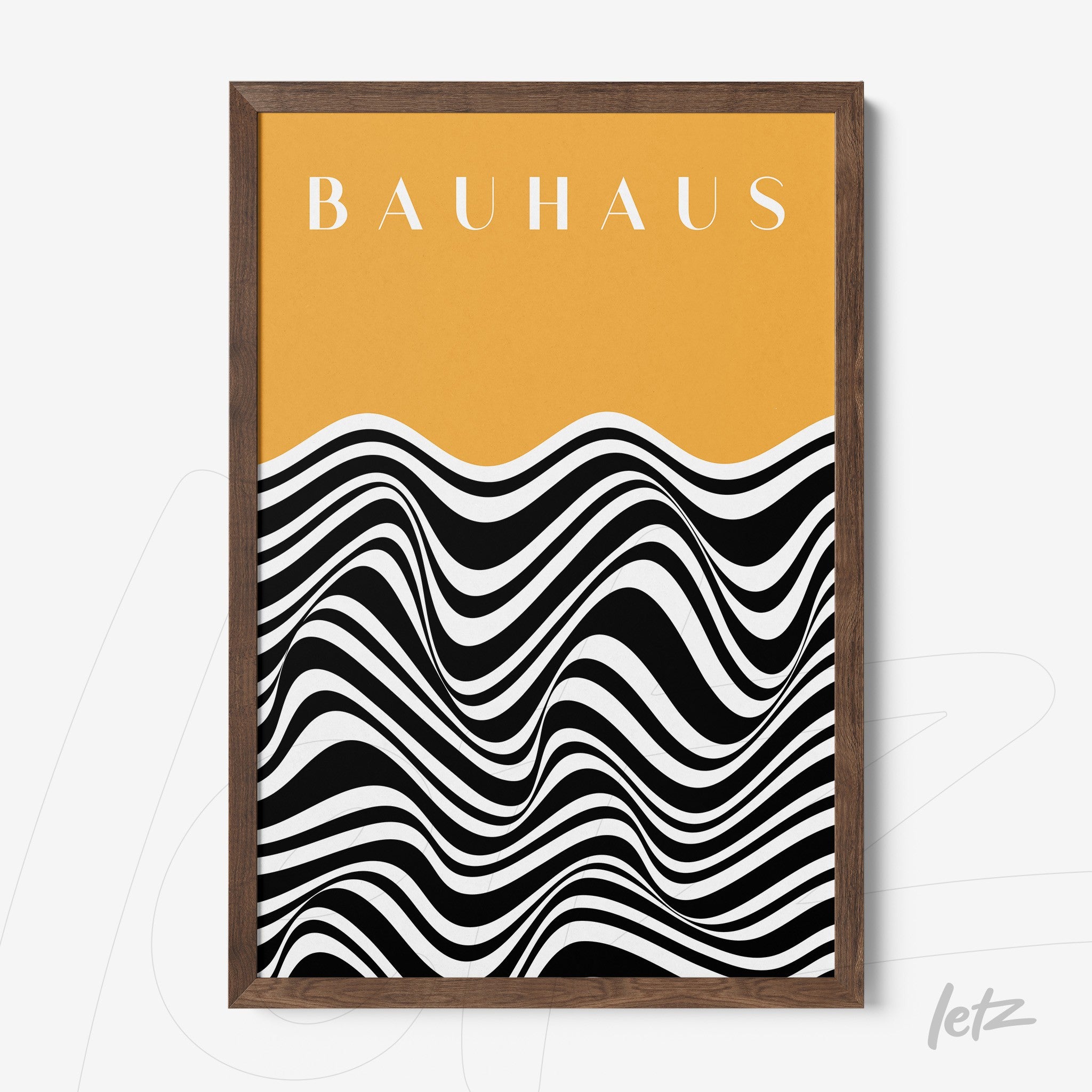 poster featuring black and white wavy design with orange background and the word bauhaus at the top, framed in dark wood