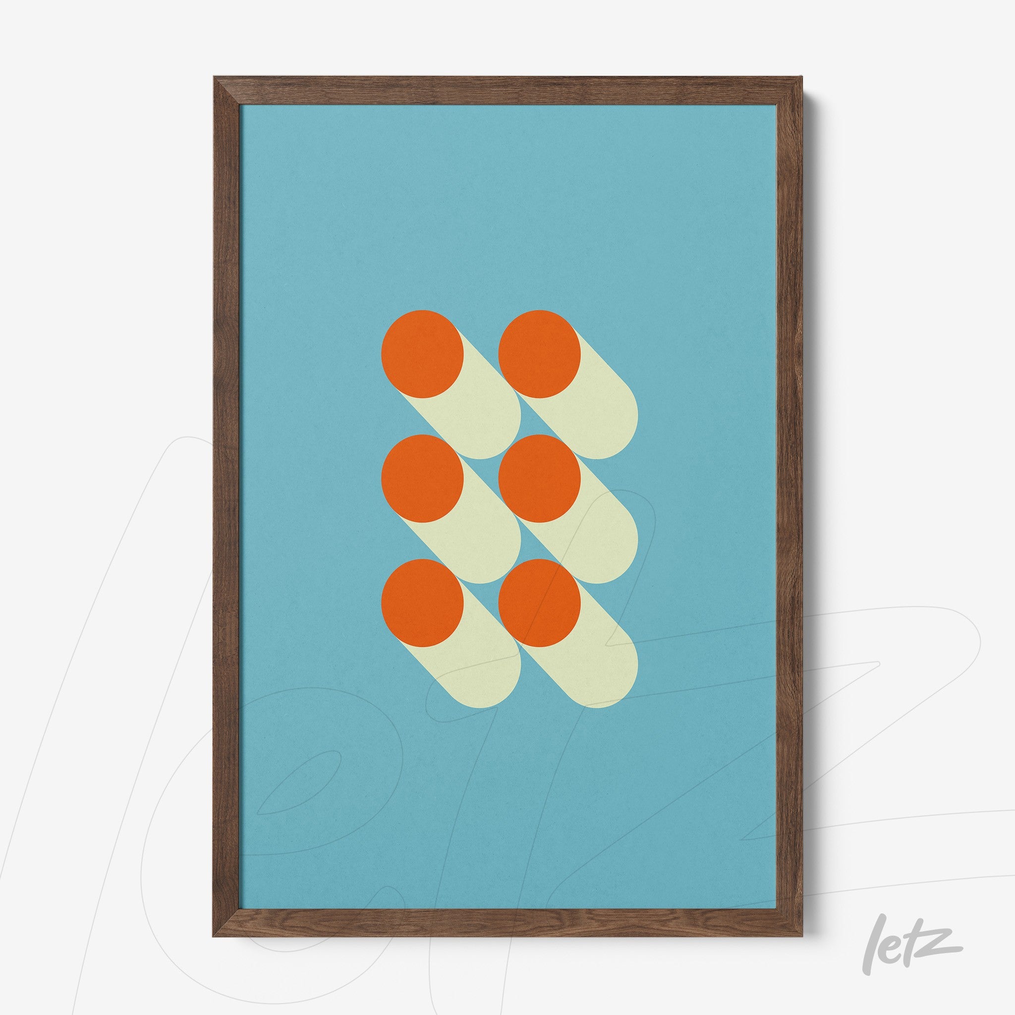 abstract framed art with orange circles on blue background in dark wood frame