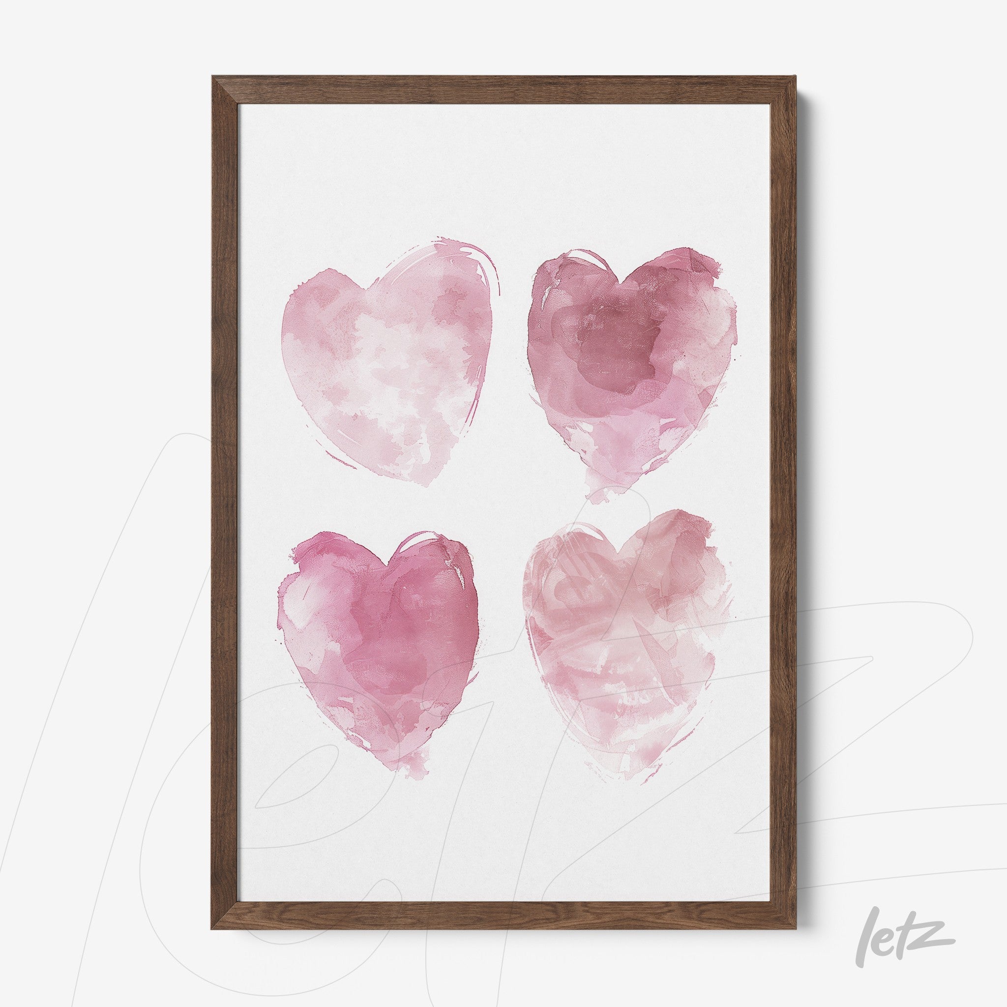 framed artwork featuring four pink watercolor hearts in dark wooden frame