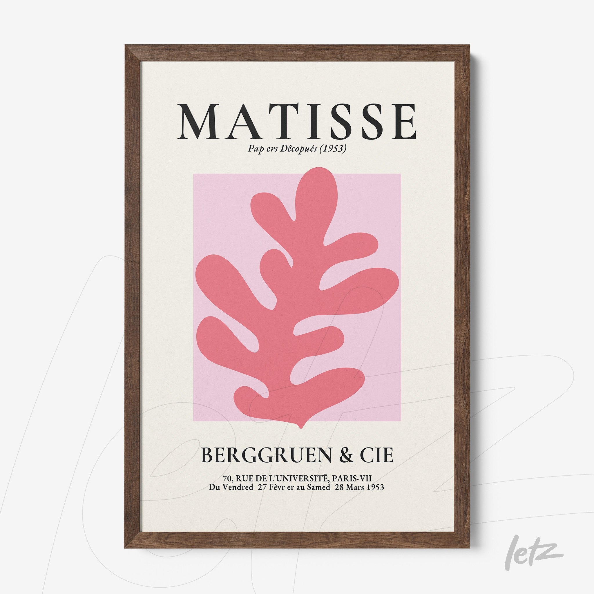 framed art inspired by matisse featuring a pink leaf on a light pink background with a dark wood frame