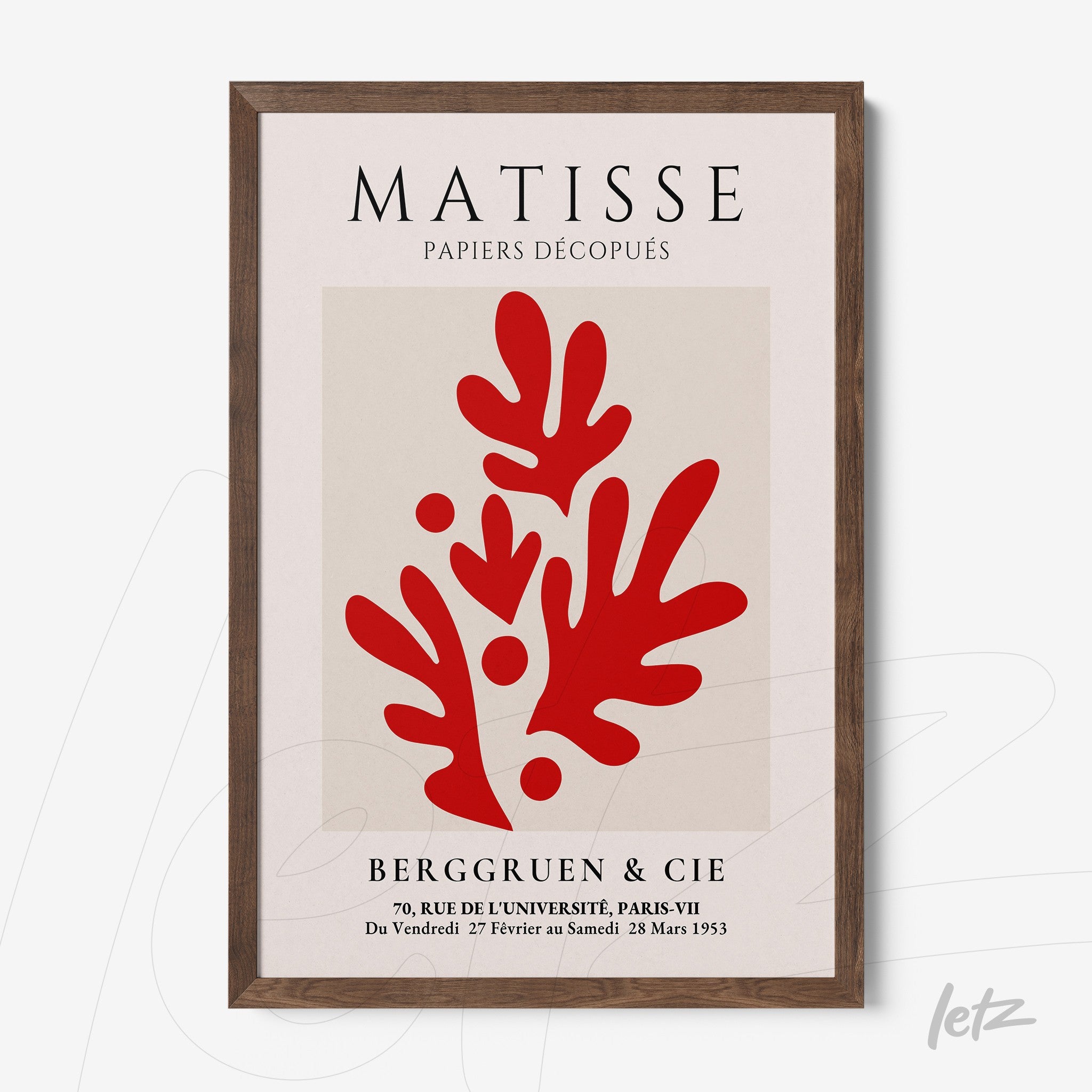 framed wall art of Matisse featuring abstract red shapes on a light background with dark wooden frame