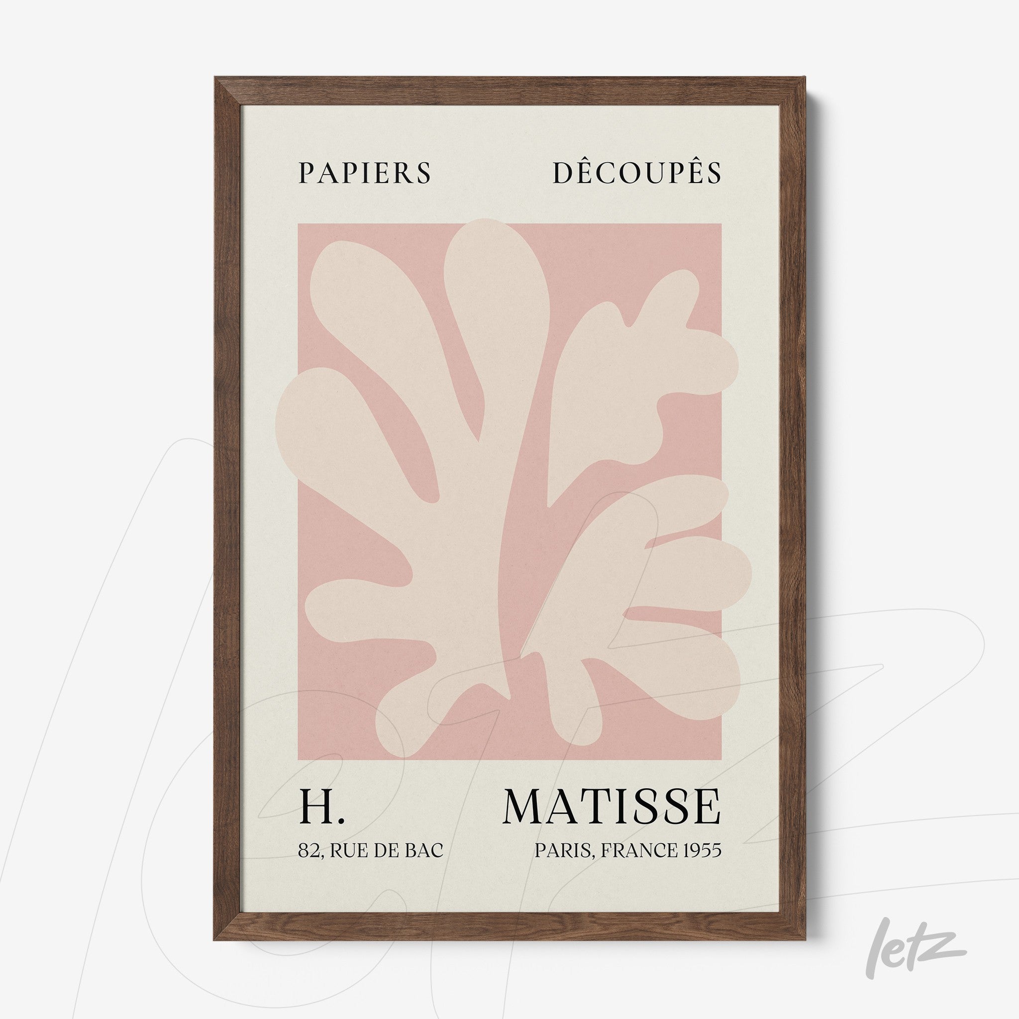 framed wall art featuring pastel-colored stylized leaves design in dark wood frame