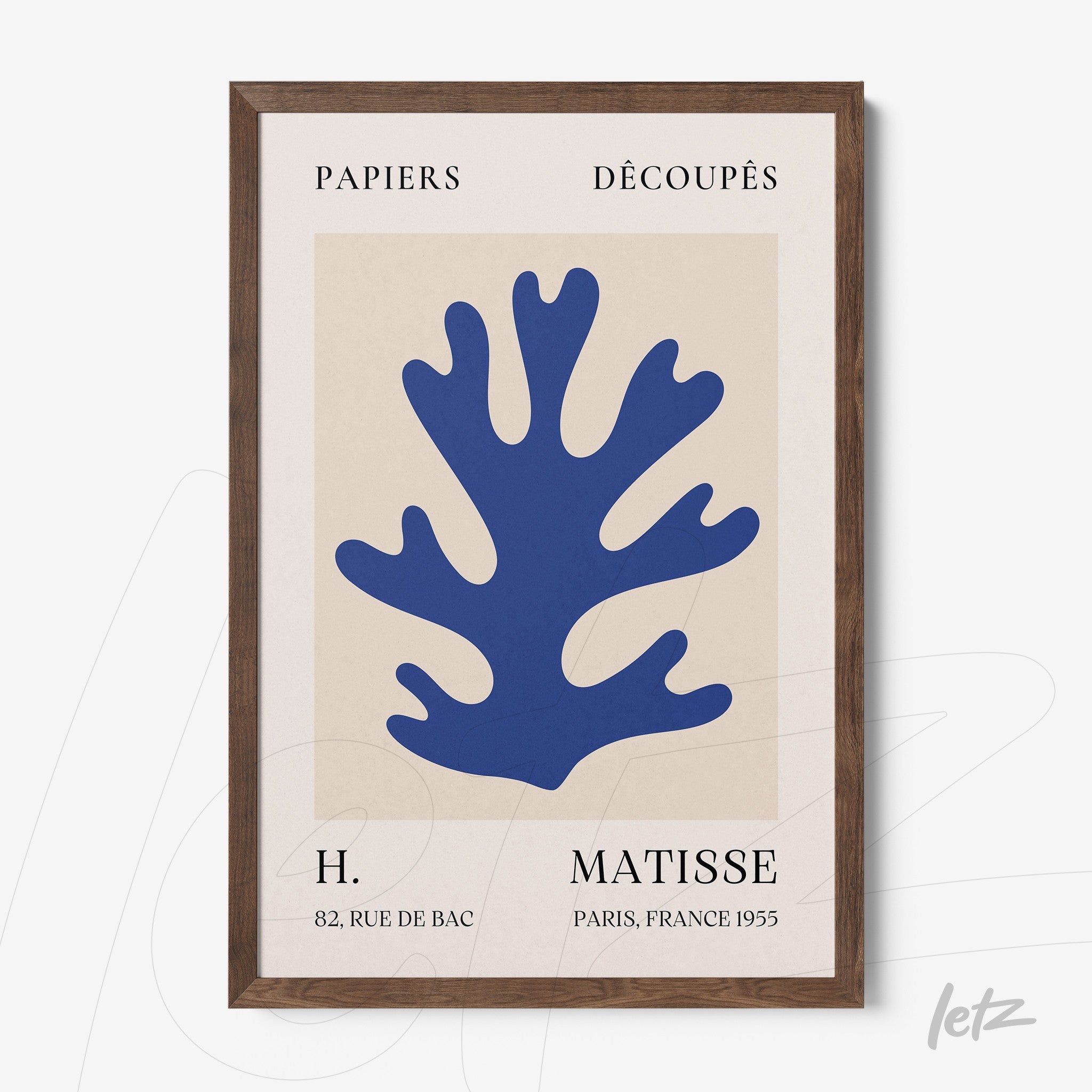 contemporary wall art featuring a blue coral design on a light background, framed in dark wood