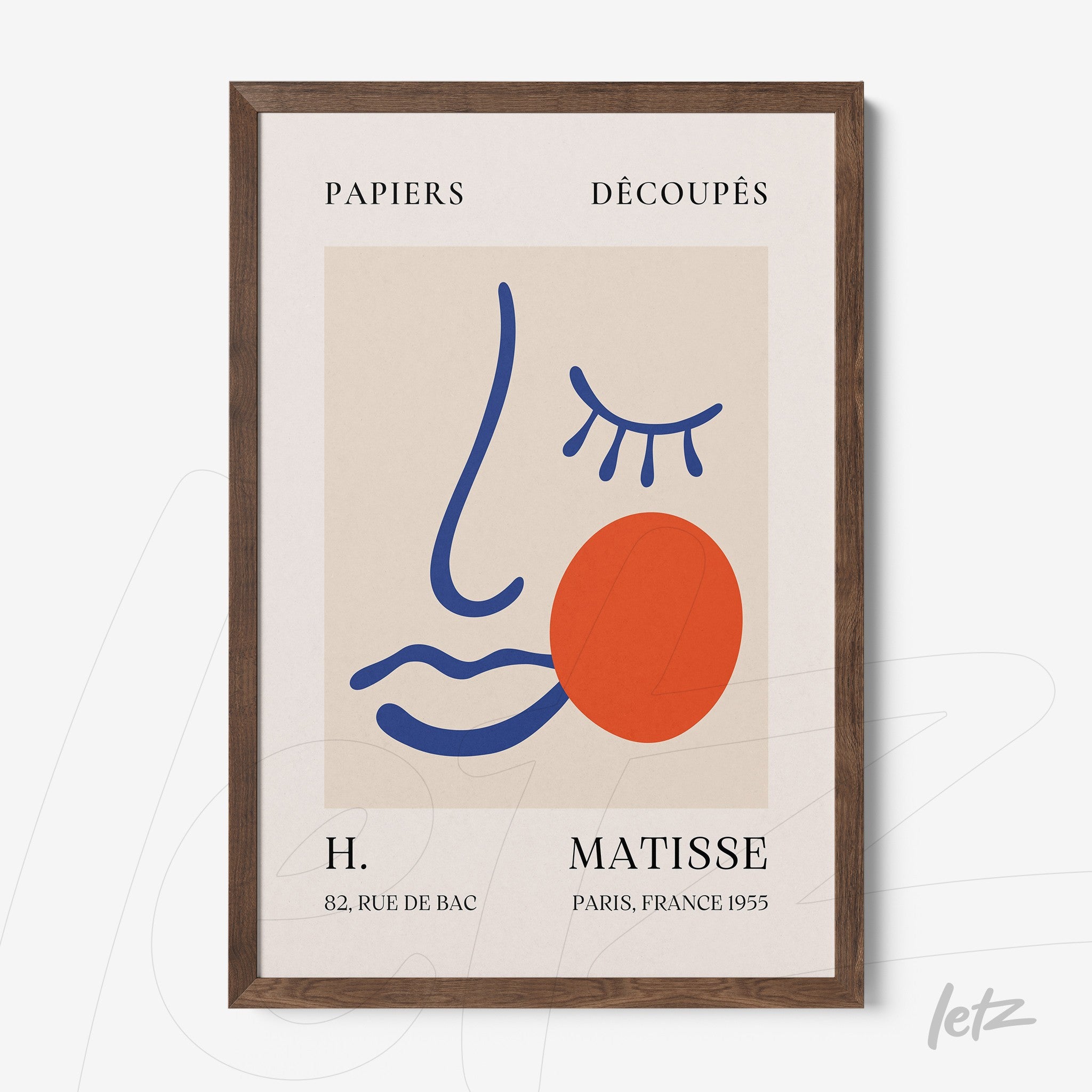 framed wall art featuring abstract stylized face design in blue, orange and red tones on a neutral background