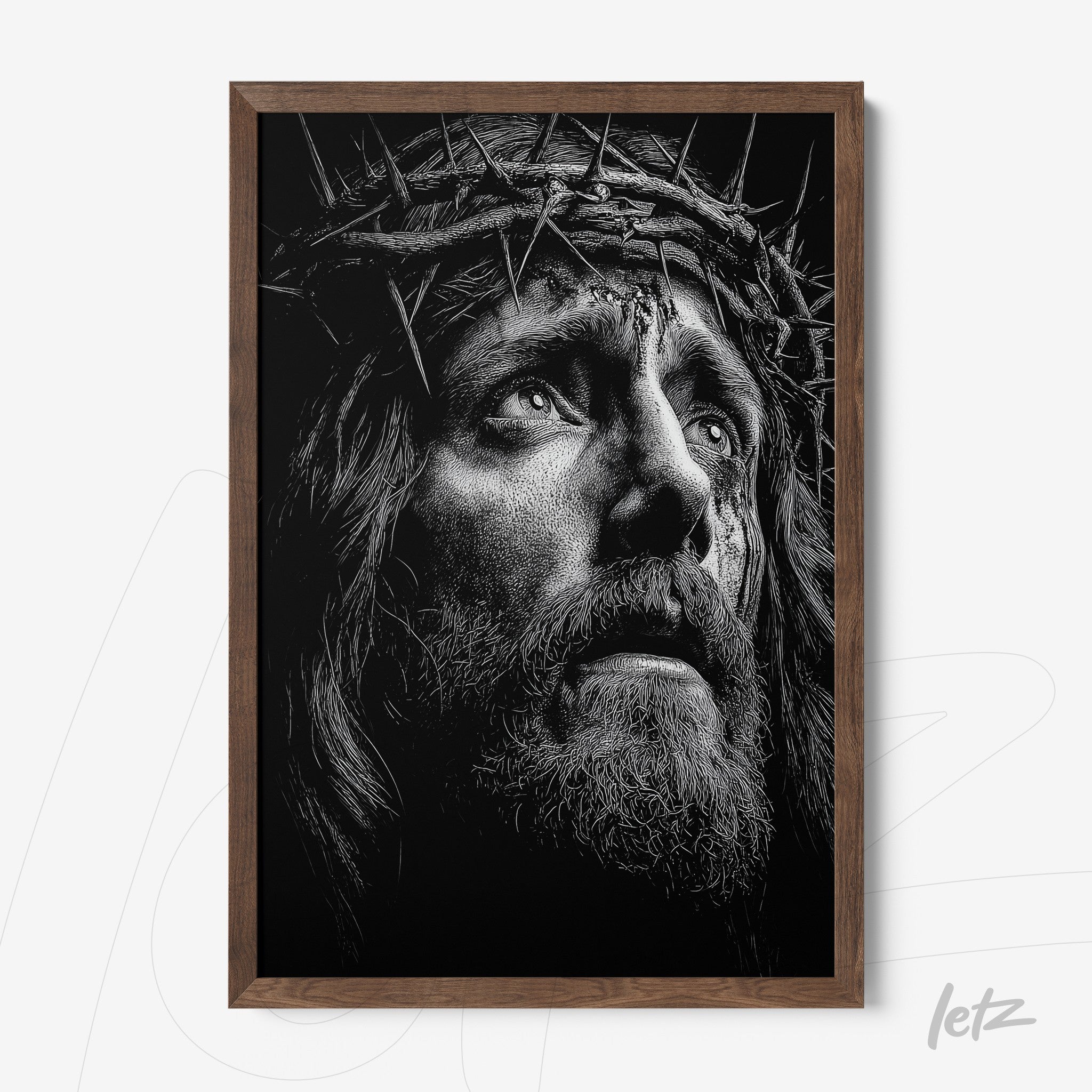 framed black and white portrait of a figure with a crown of thorns in a dark wood frame