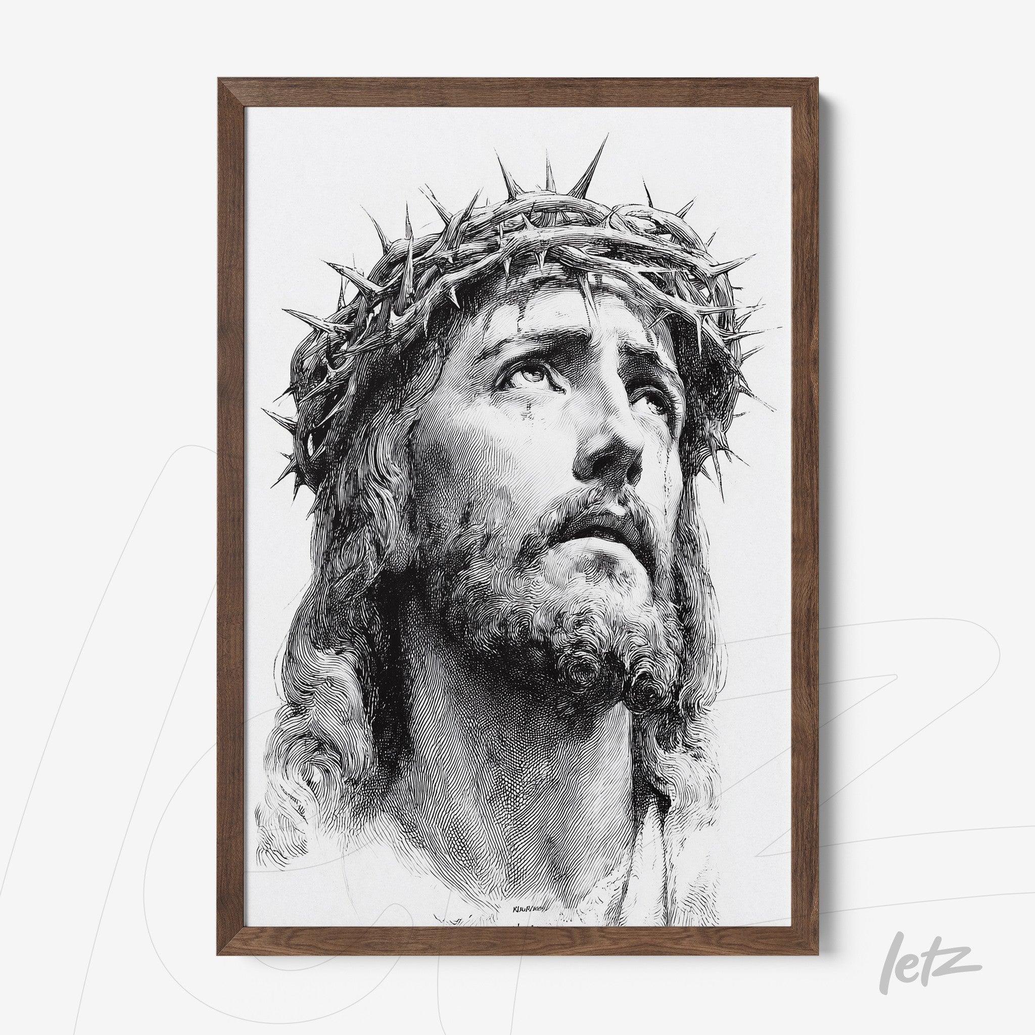 framed artwork of a black and white portrait of Jesus Christ with a crown of thorns in a dark wood frame