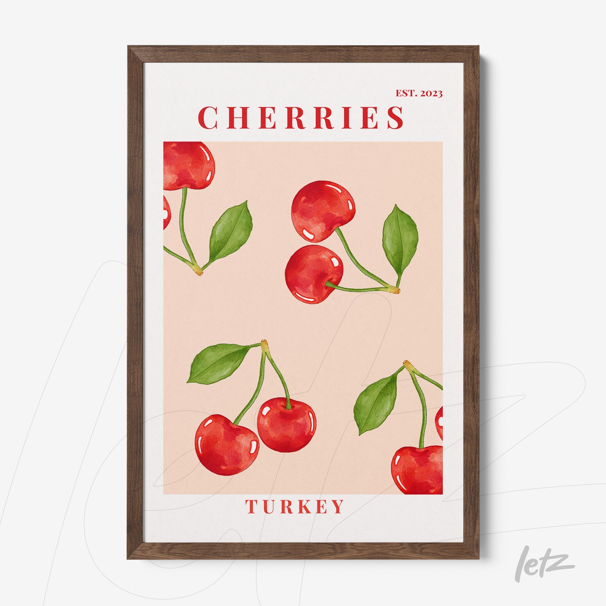 framed wall art featuring bright red cherries on a pink background with modern typography
